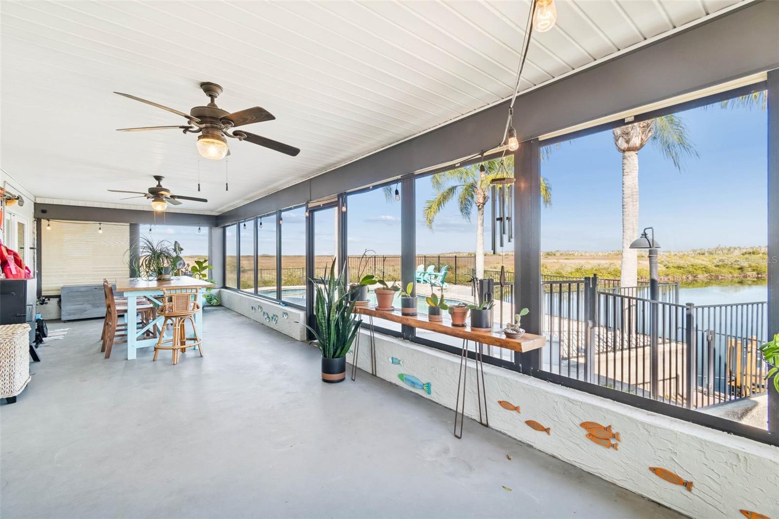 Covered porch – overlooking pool and waterway