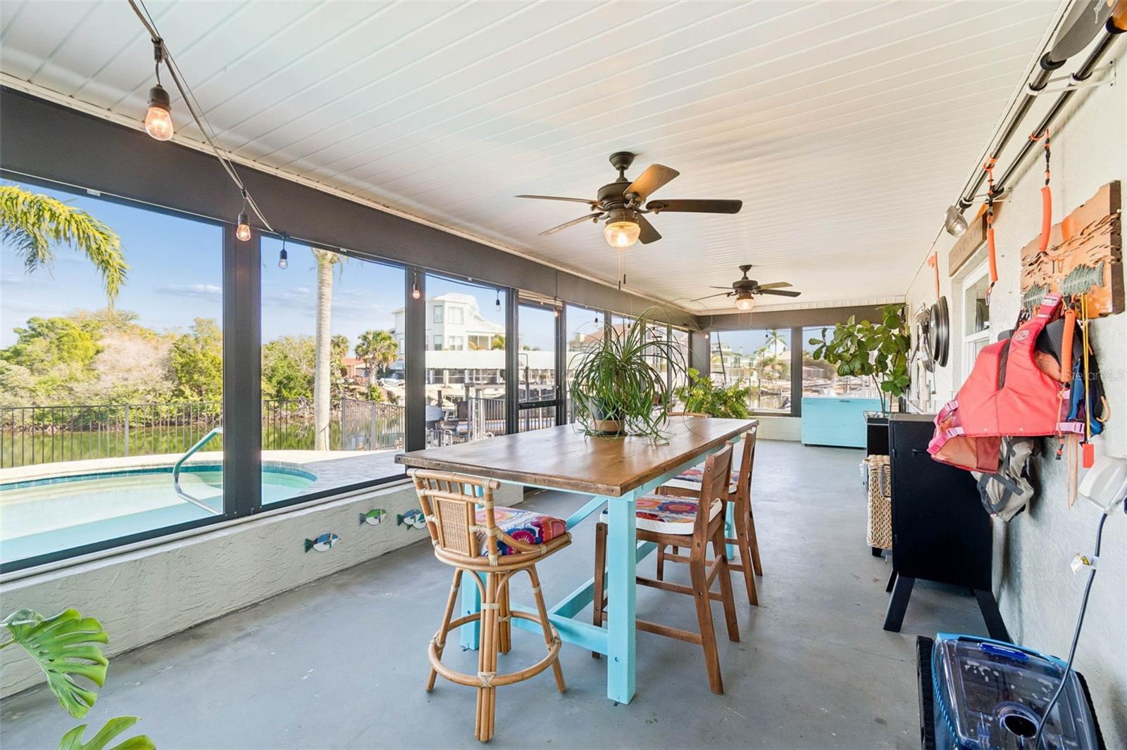 Covered porch – overlooking pool and waterway