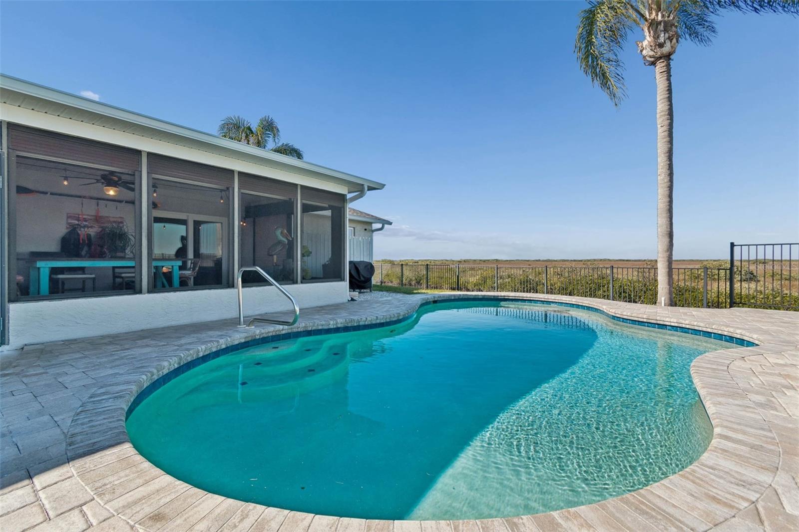 Rear of home – full view of pool and outdoor living area
