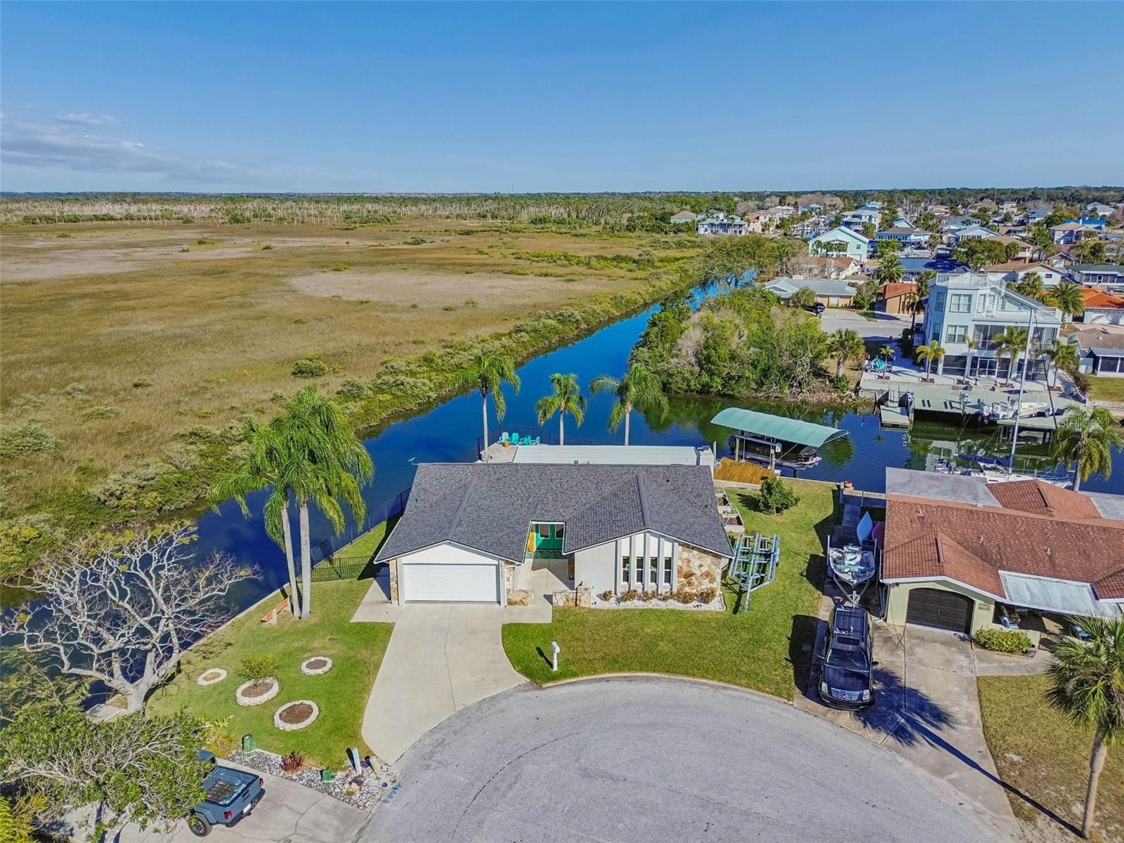 Aerial shot – property positioned within waterway, marsh, and Gulf access