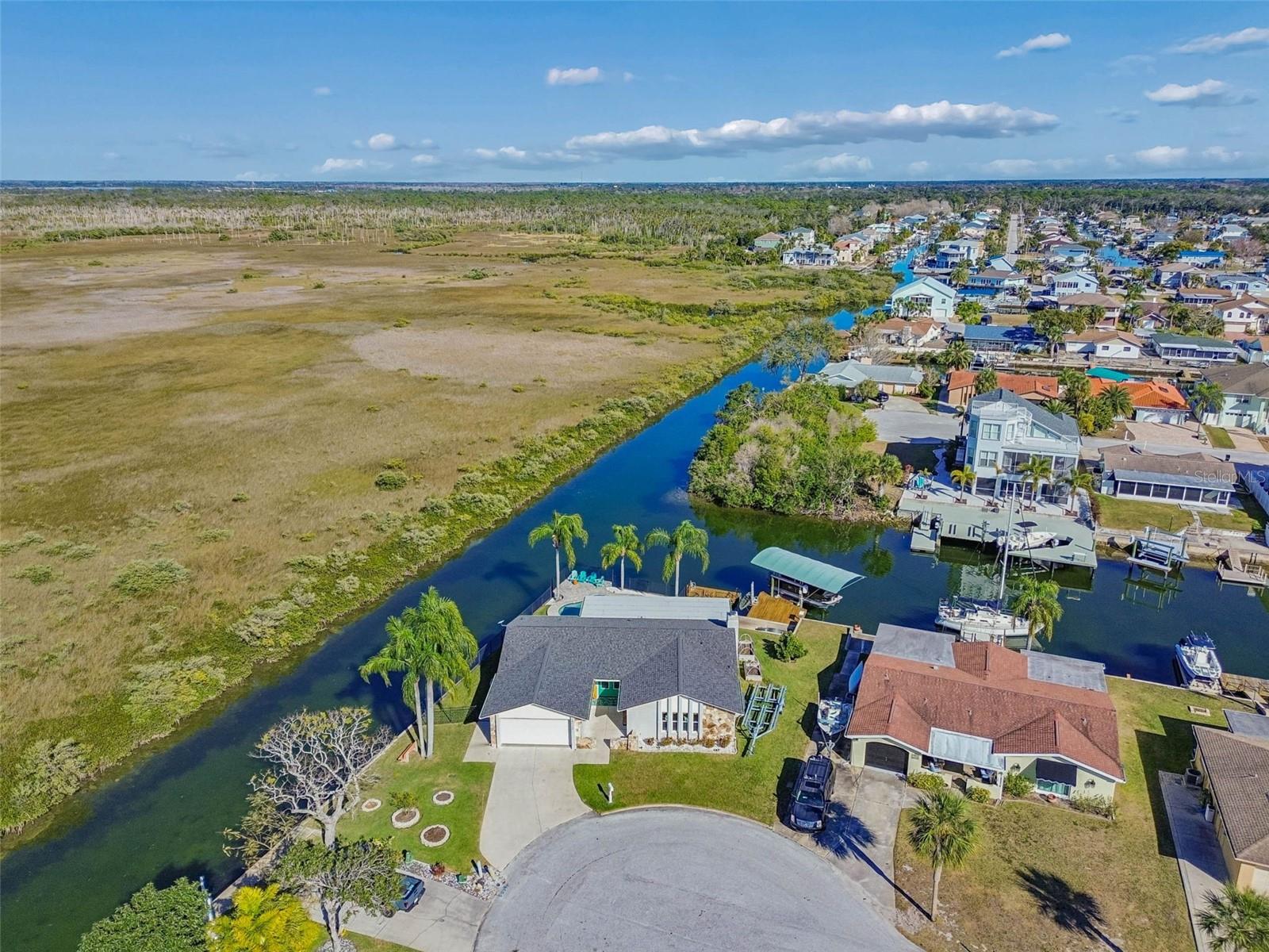 Aerial shot – property positioned within waterway, marsh, and Gulf access