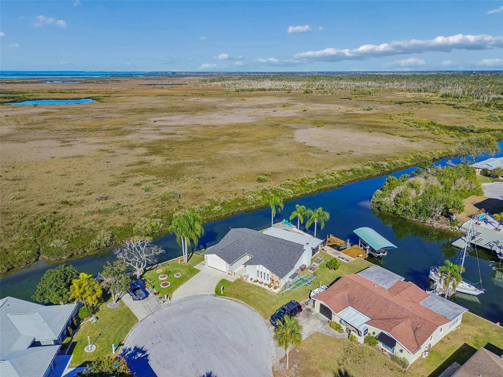 Aerial shot – property positioned within waterway, marsh, and Gulf access