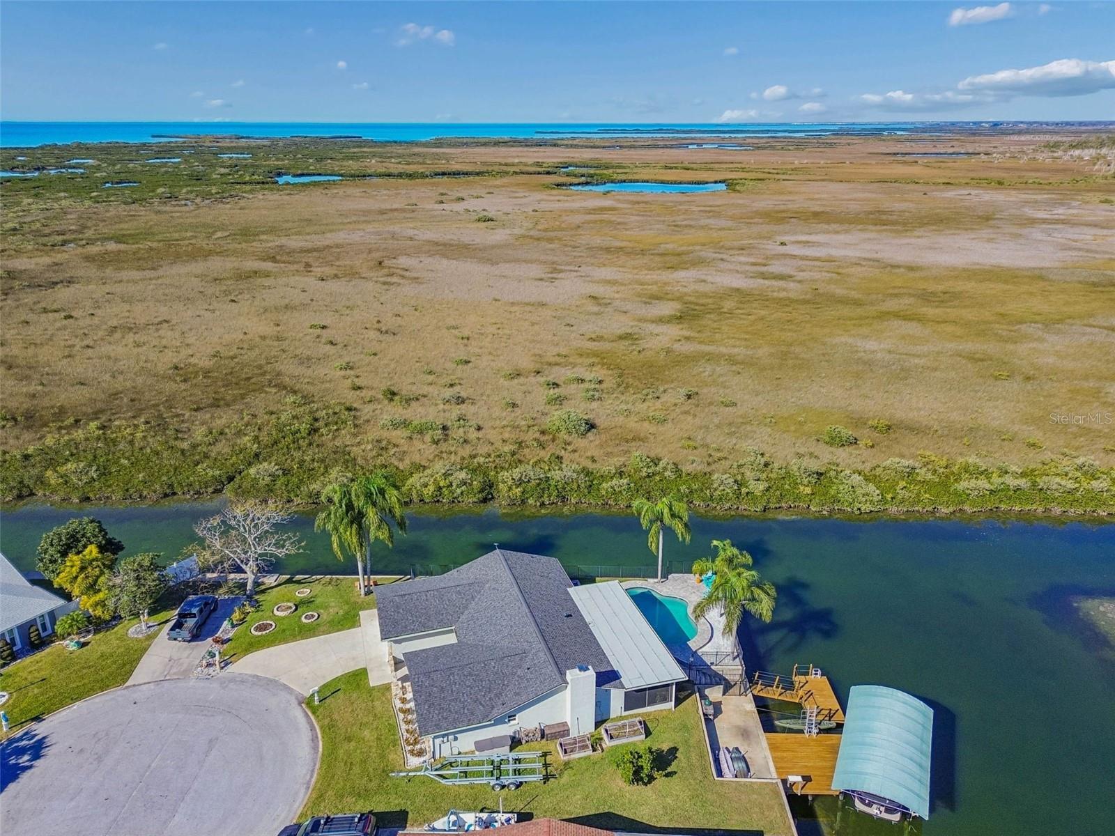 Aerial shot – property positioned within waterway, marsh, and Gulf access