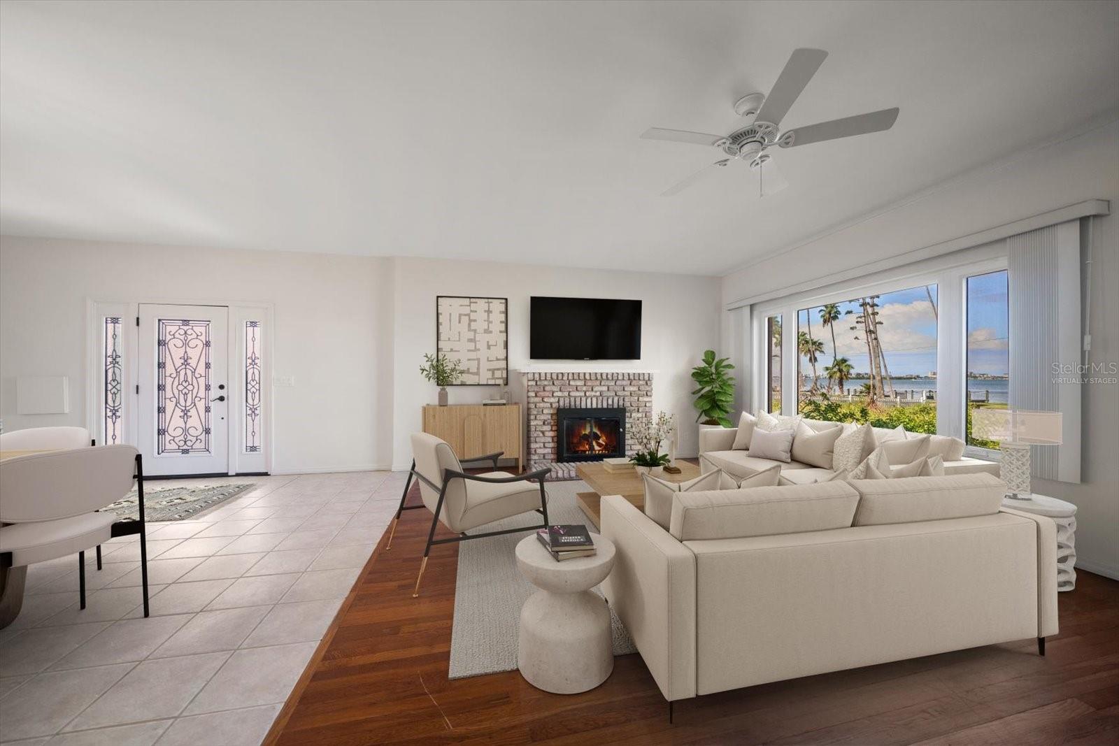 virtually staged view of living room and side door from driveway