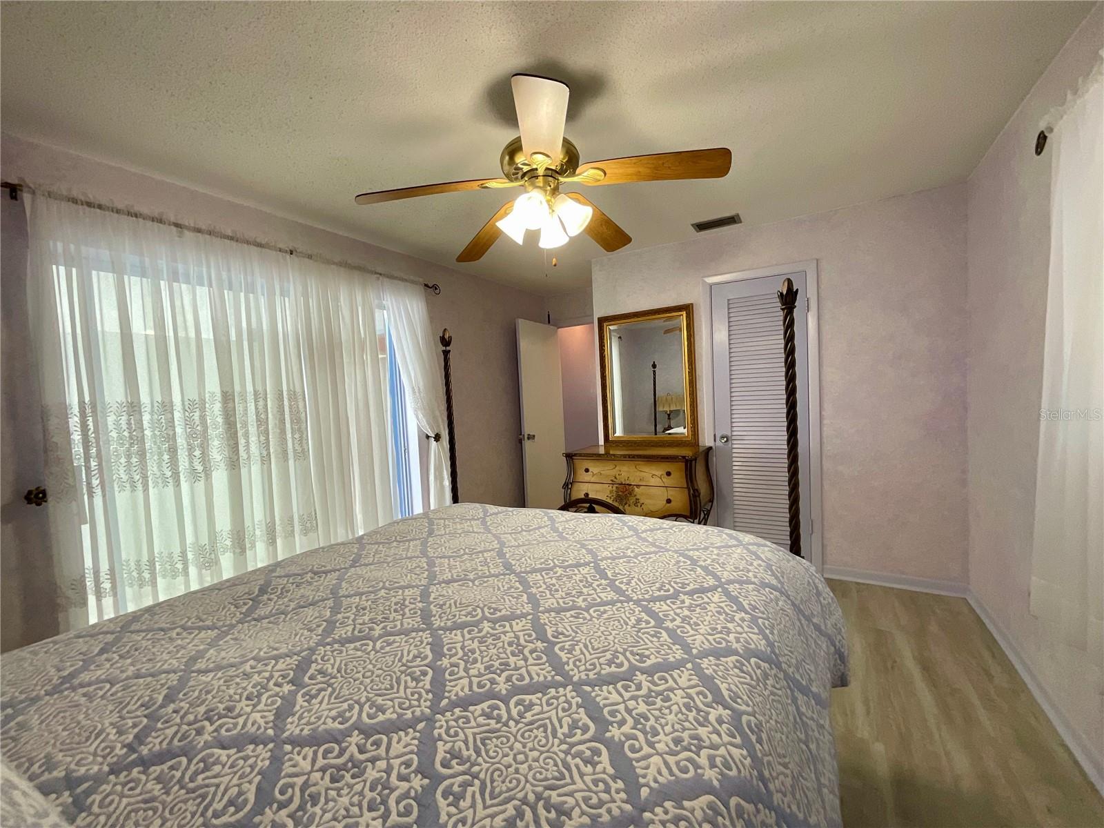 18-Primary bedroom view walk-in closet and door to hallway.