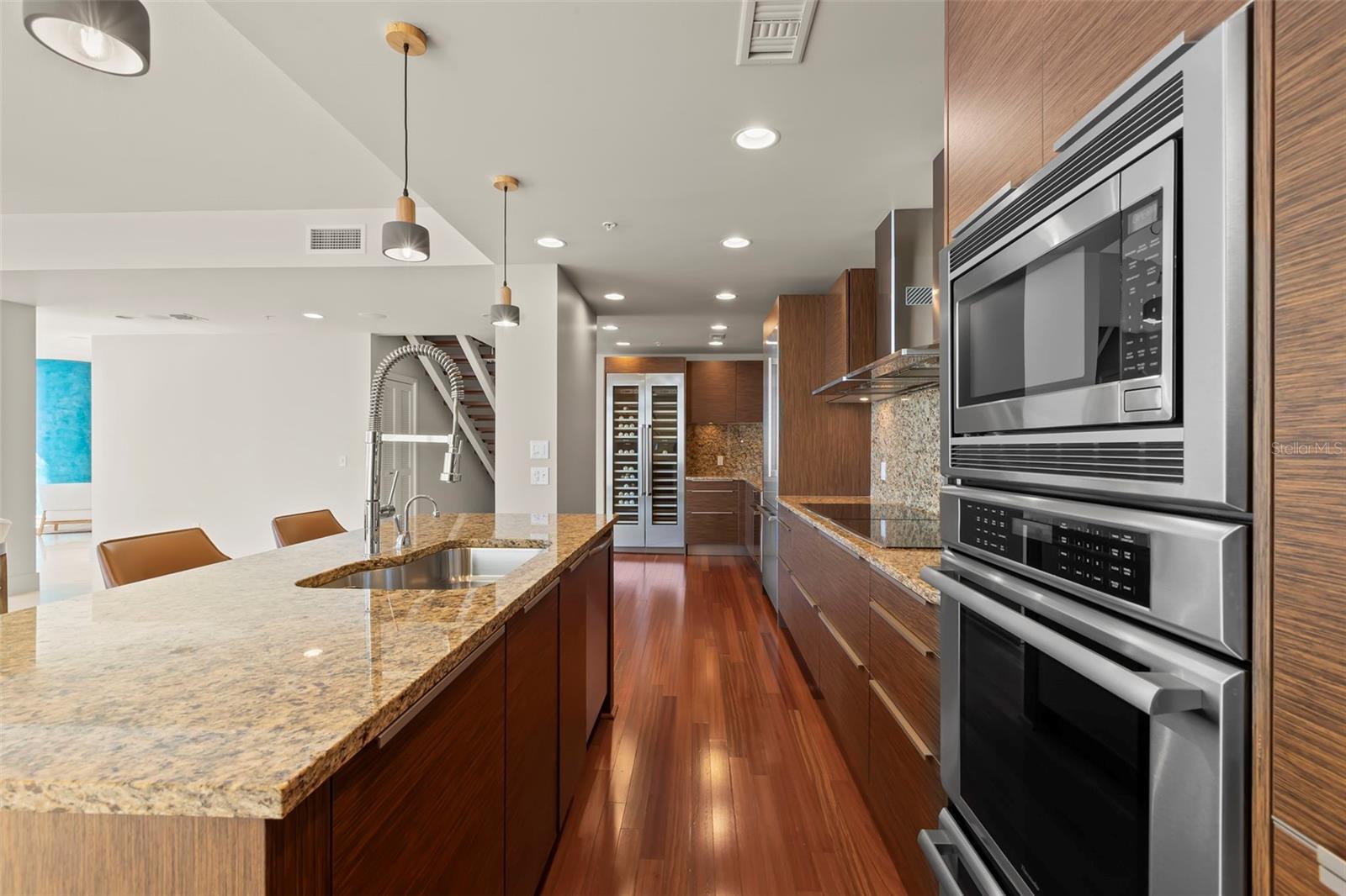 Showcase chef’s kitchen equipped with top-of-the-line Thermador appliances and 70-bottle wine cooler