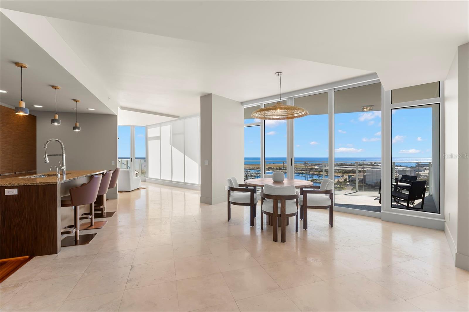 Designer chef’s kitchen and dining area bathed in radiant natural light
