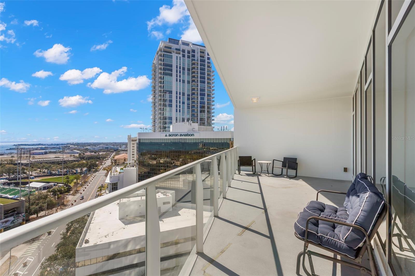 Entertain effortlessly with a balcony off the kitchen and dining space featuring captivating water views
