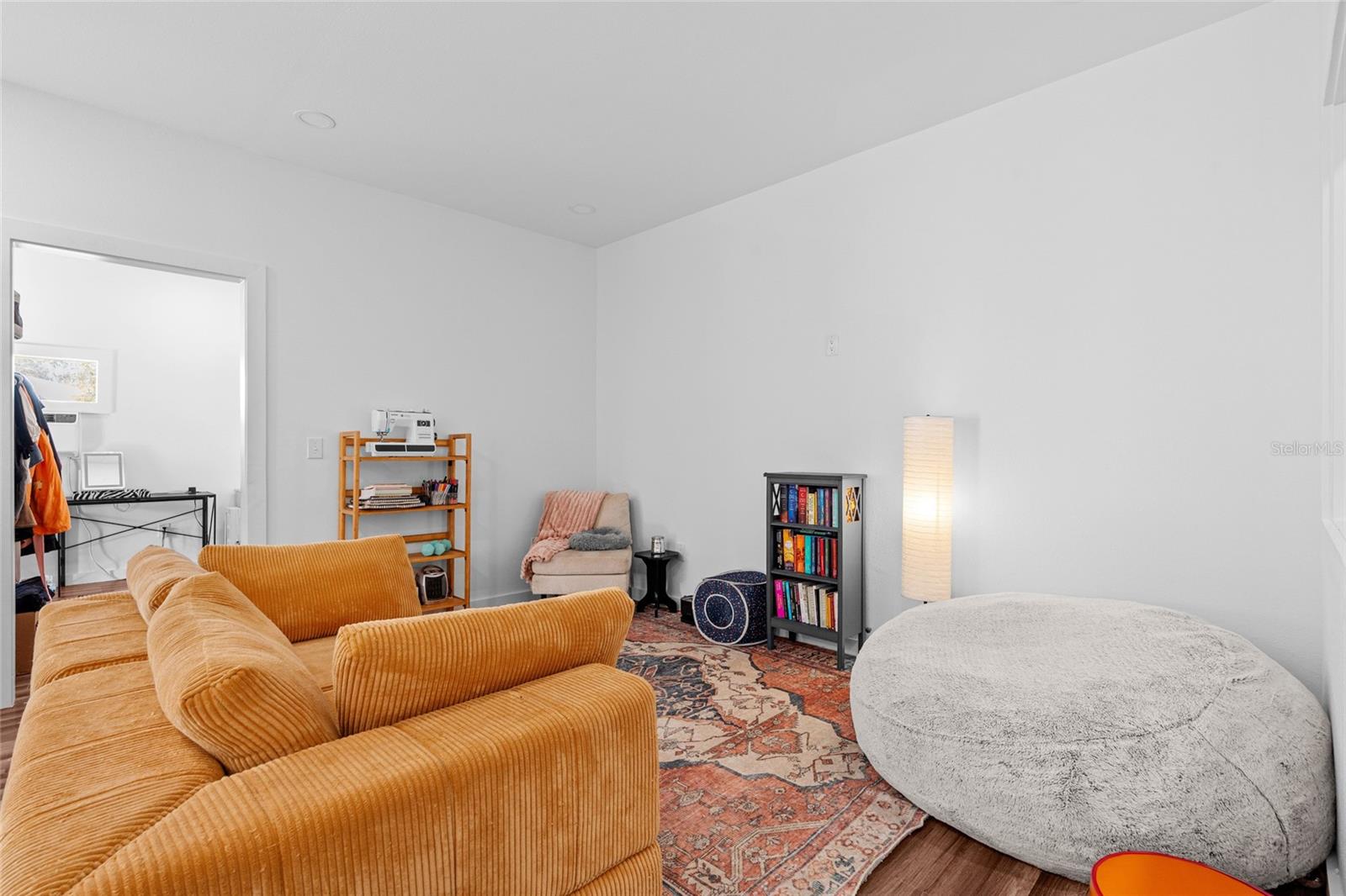 Living room with bedroom entrance
