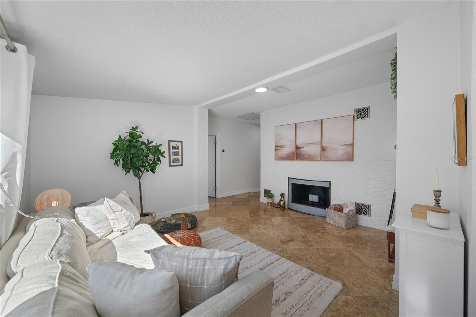 Living room with wood burning fireplace