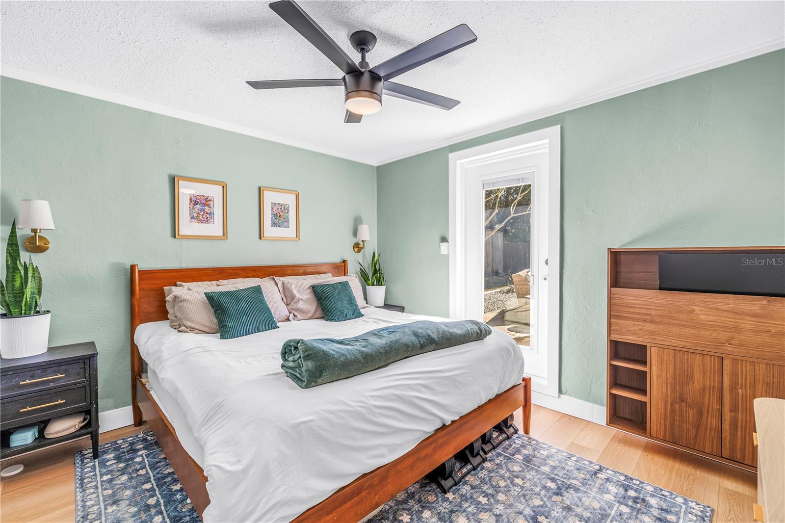 Primary Bedroom with 2 walk-in closets with custom shelving. French door leading to pool