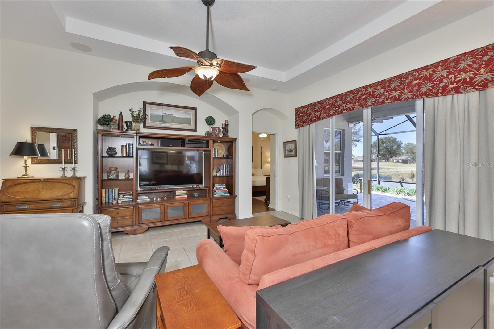 Architectural features such as niches, tall ceilings and arched doorways are caried throughout the home.