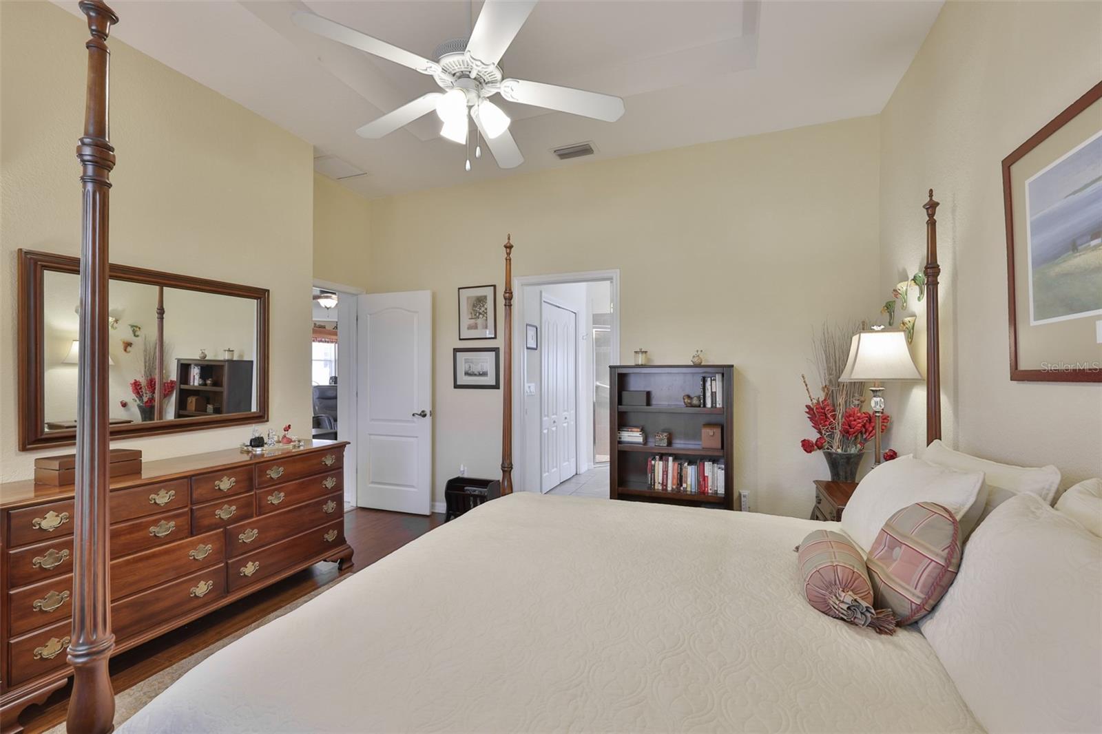Large owners suite is beautifully detailed with trey ceilings, neutral paint tones and beautiful flooring.