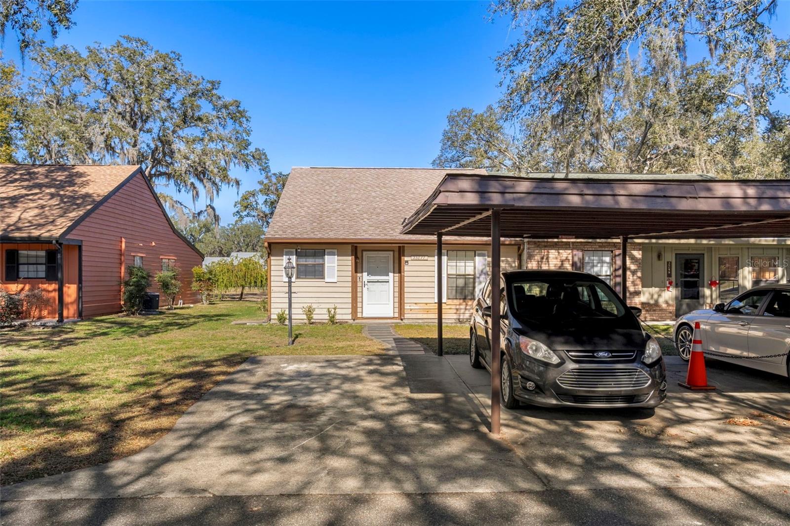 Front of home showing carport & guest parkiing space