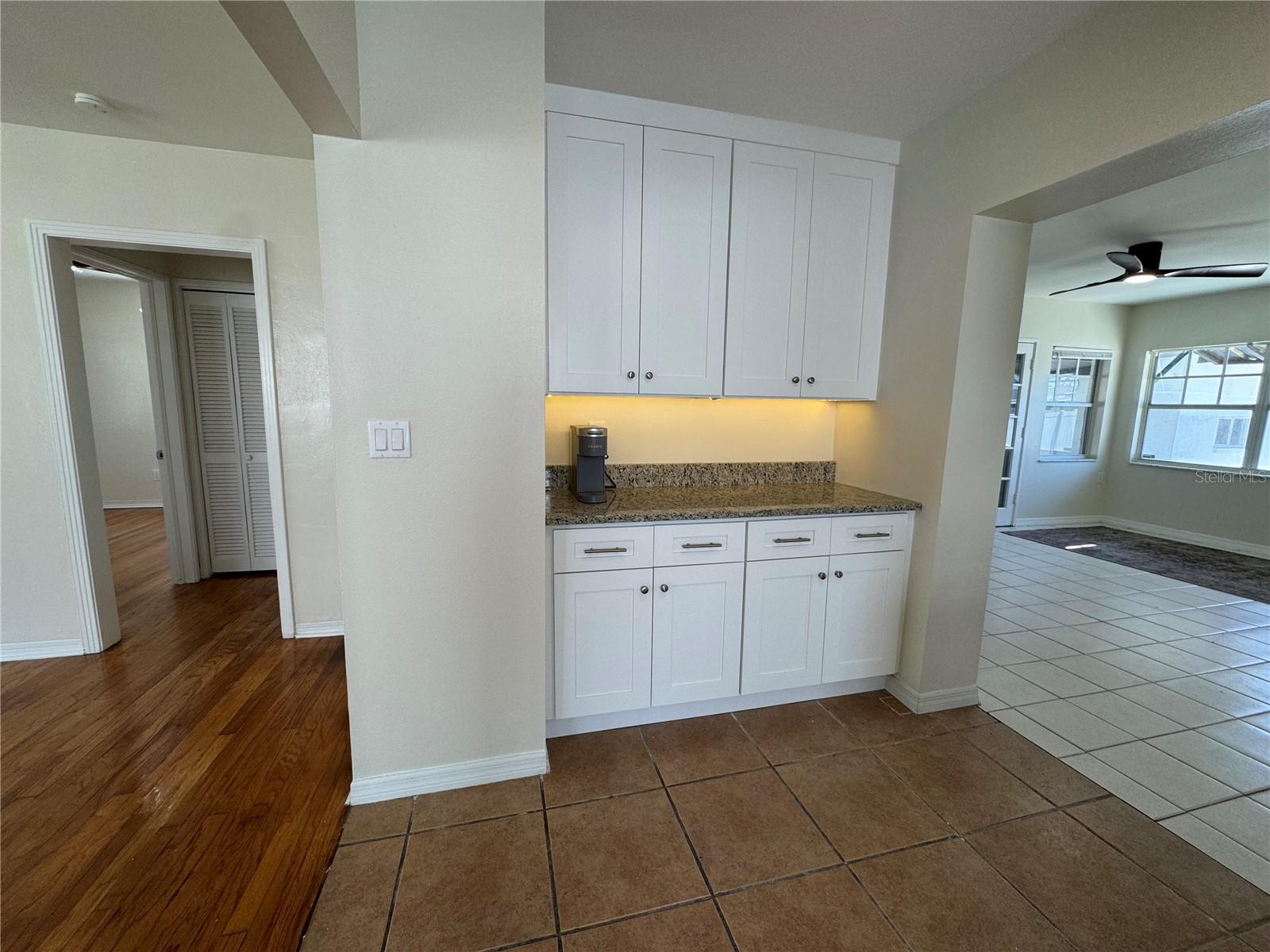 Kitchen bar area with back family room view