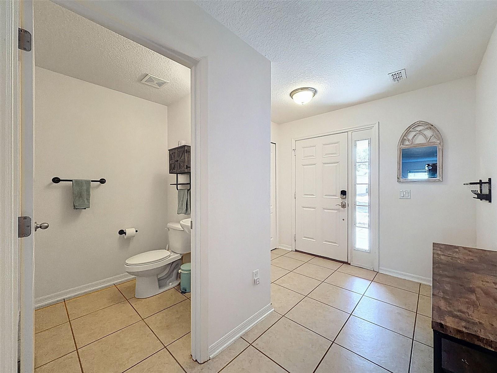 Inside front foyer/ first floor .5 bath