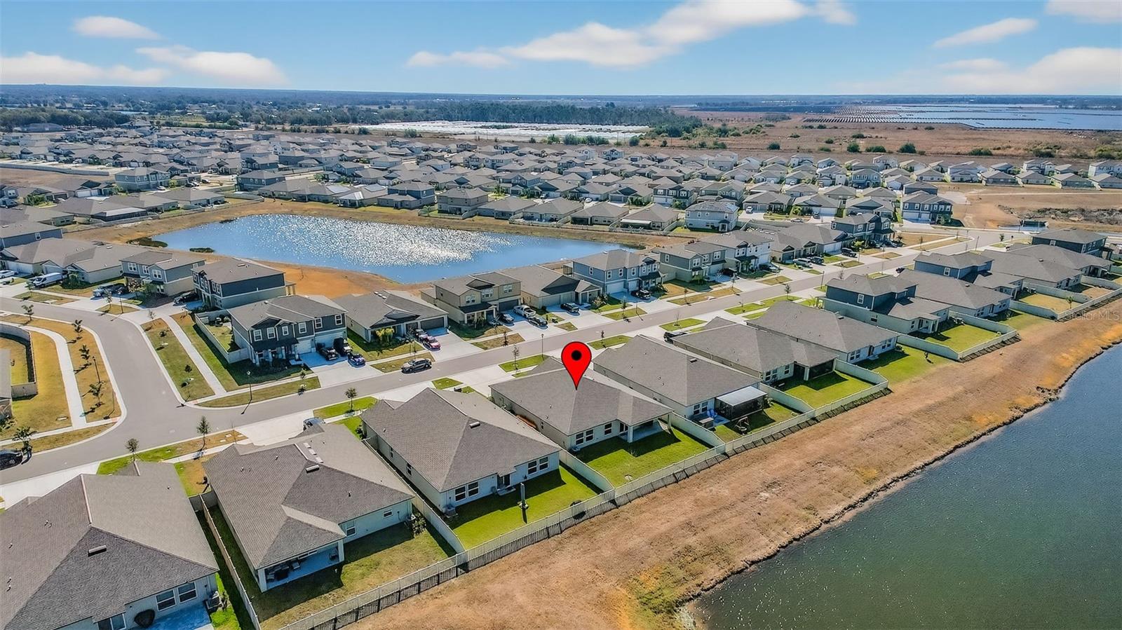 Aerial view of home and neighborhood