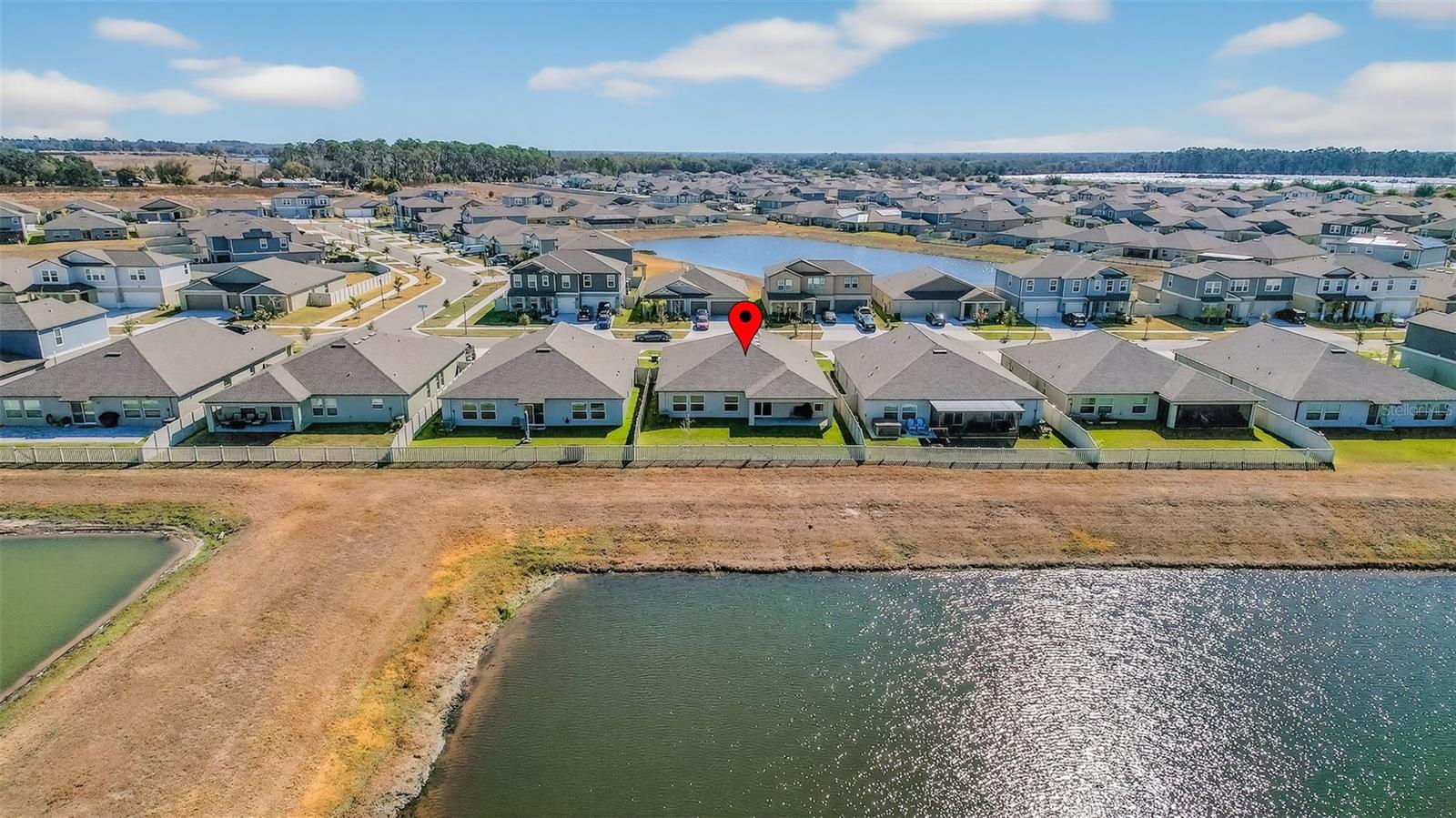 Aerial view of home and neighborhood
