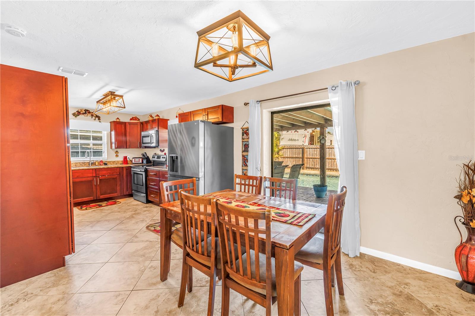 Dining room showcasing pool views.