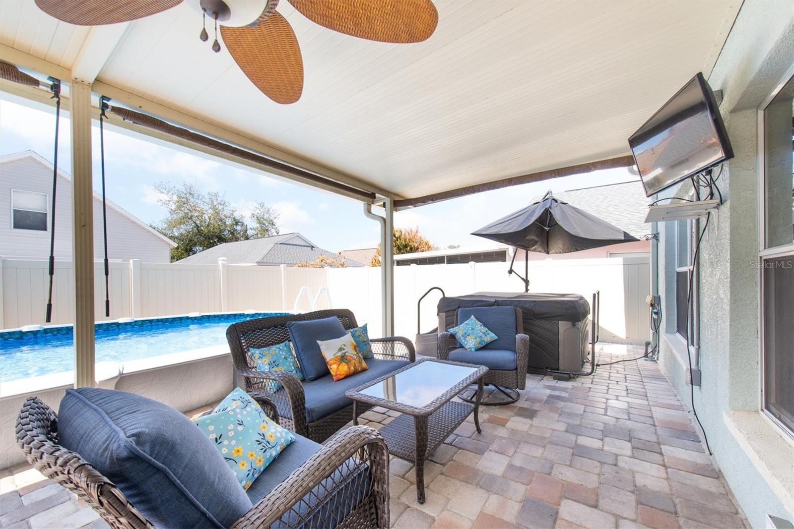 A pool, a hot tub & a TV! This is the perfect place for outdoor parties. Plus the yard is paved so you won't have to worry about dirty feet in the house.
