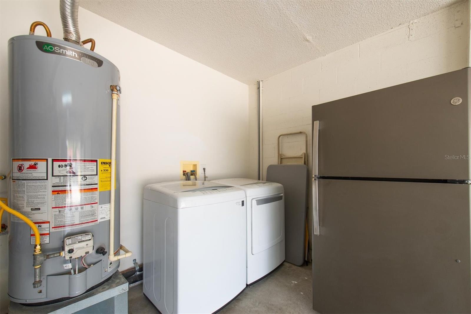 Theres a second refrigerator in the garage & an LG washer & dryer in the garage.