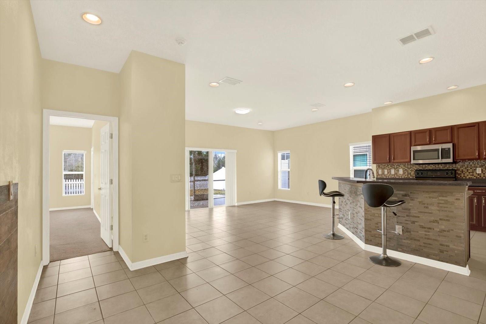 Open-concept layout connecting kitchen and living areas