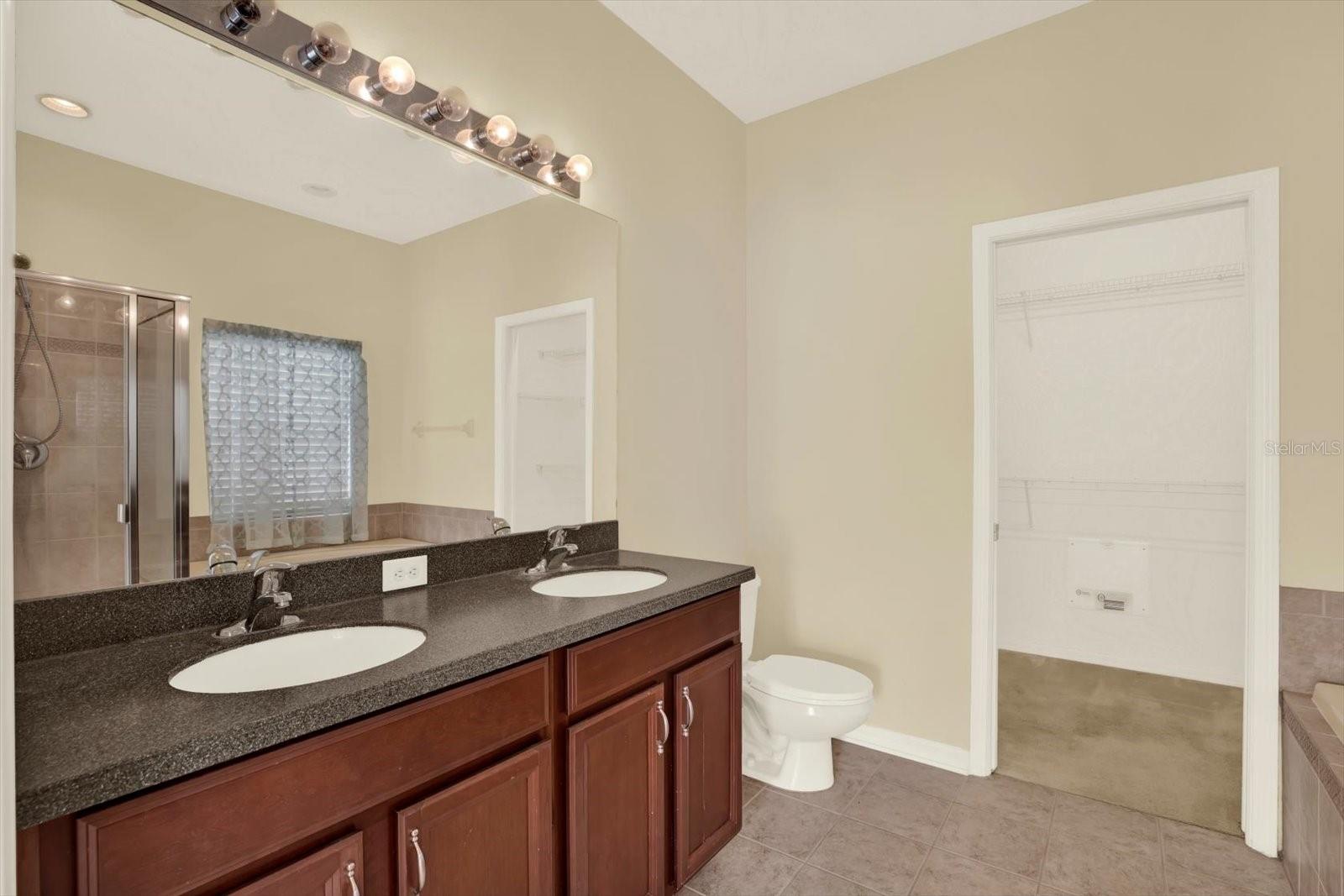 Owner’s bathroom with dual sinks and soaking tub