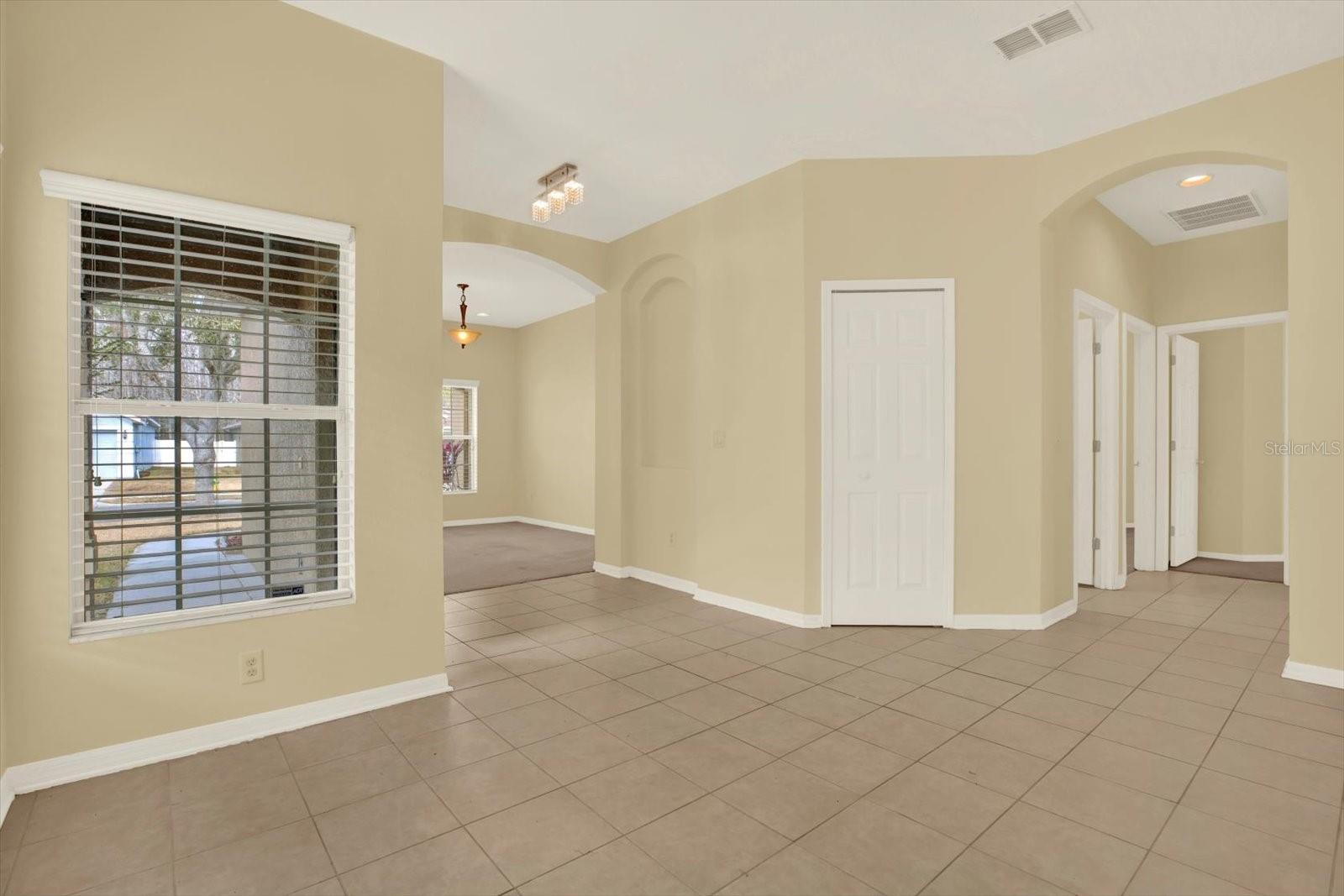 Bright open living area with multiple gathering spaces