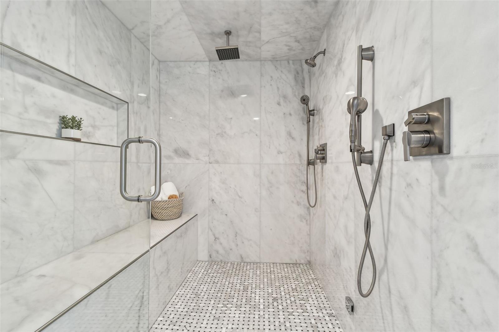 Primary Bathroom-Steam shower with dual overhead rain shower & wall shower heads with dual wand.