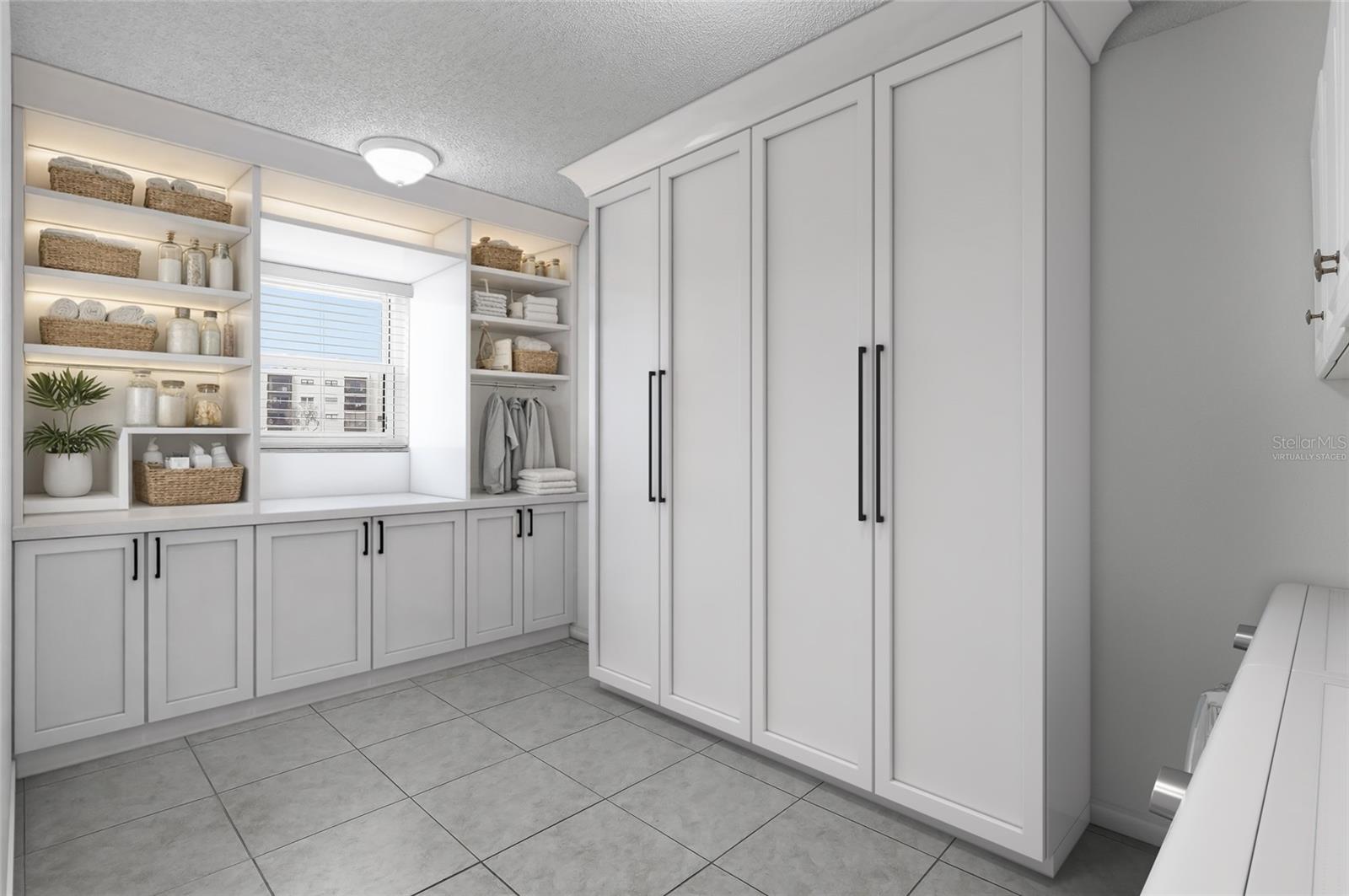 Virtually Staged. Large laundry/pantry room with a sample of how it could be transformed.