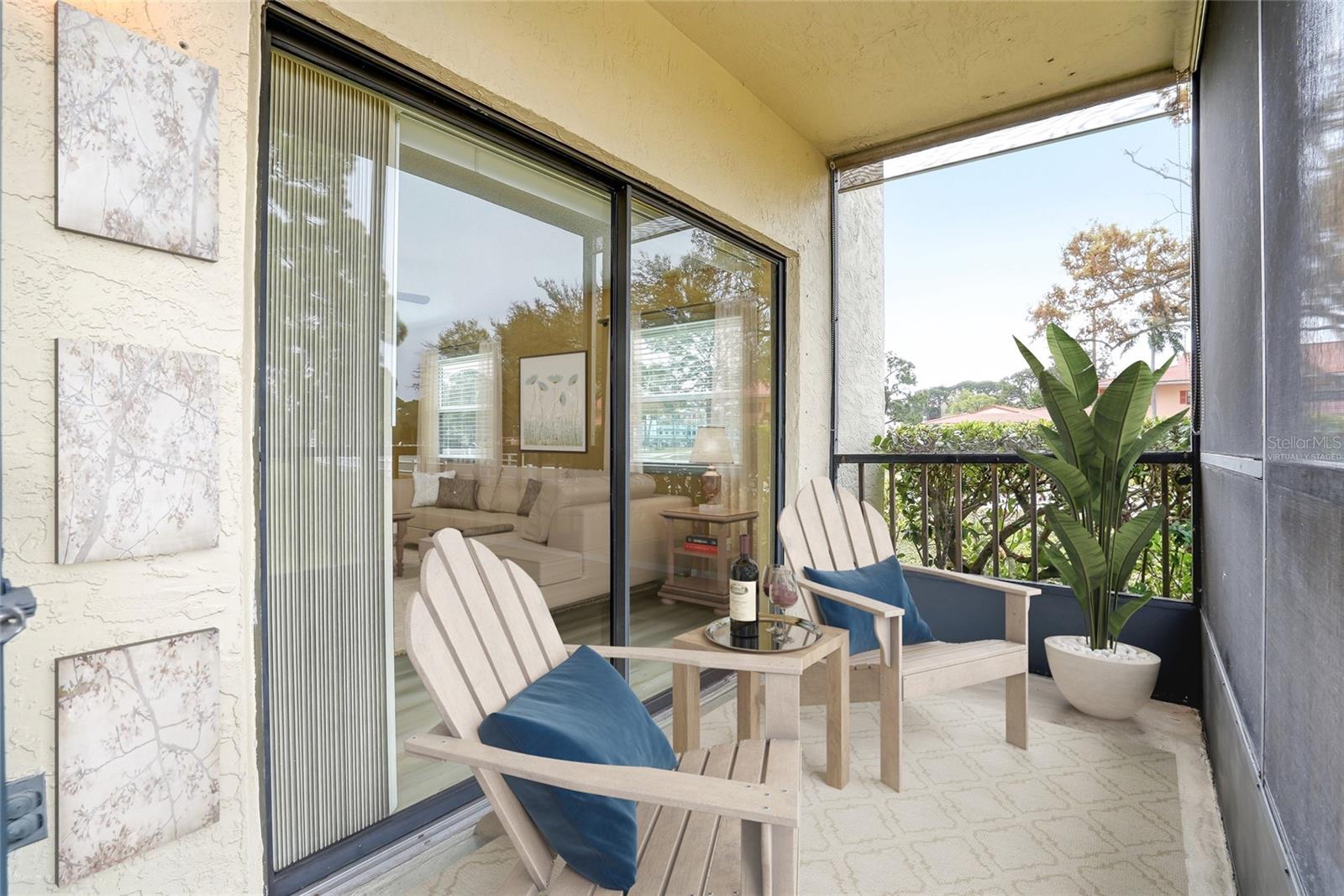 Virtually Staged. Screened lanai just off the living area—perfect for indoor/outdoor living.