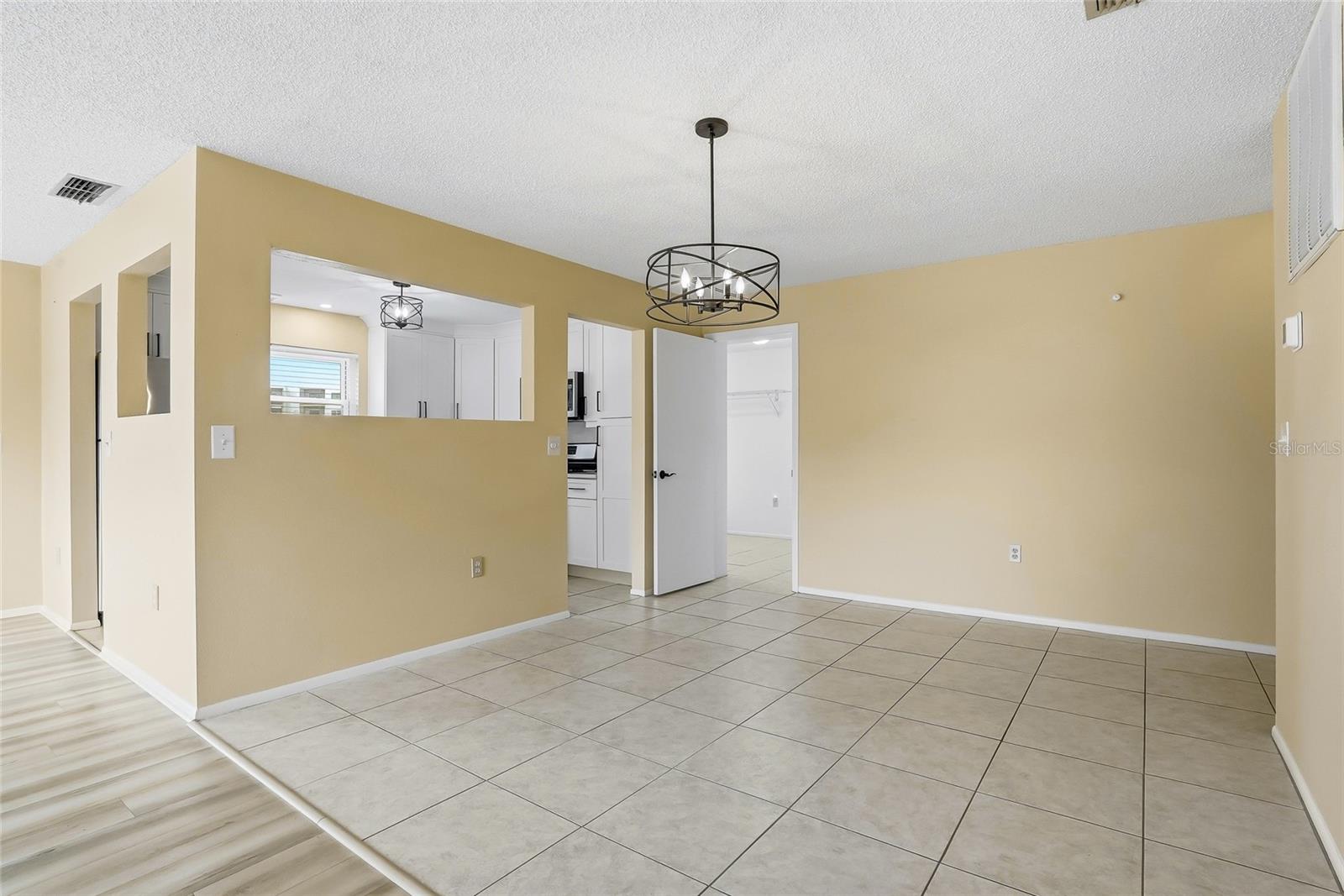 Dedicated dining area with convenient pass-through to the kitchen.