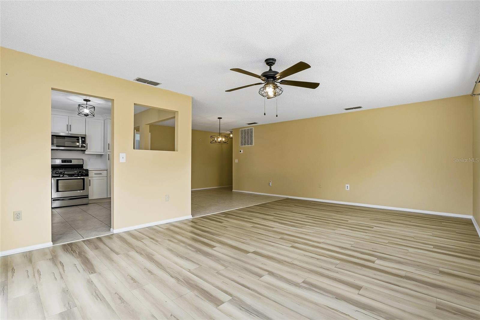 Another angle of the expansive living area, bright, open, and comfortable.