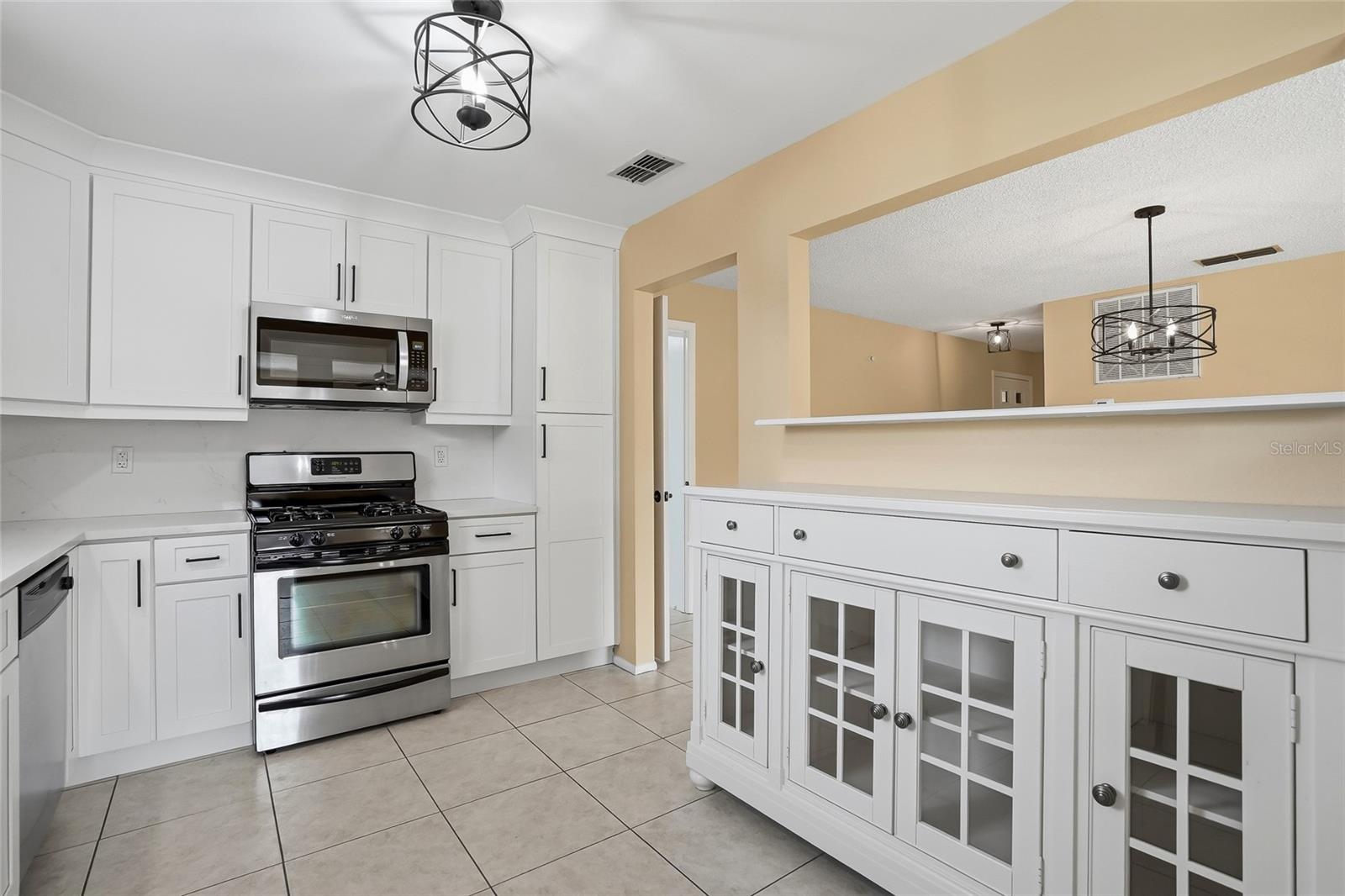 Breakfast bar + buffet, ideal for serving, storage, and entertaining.