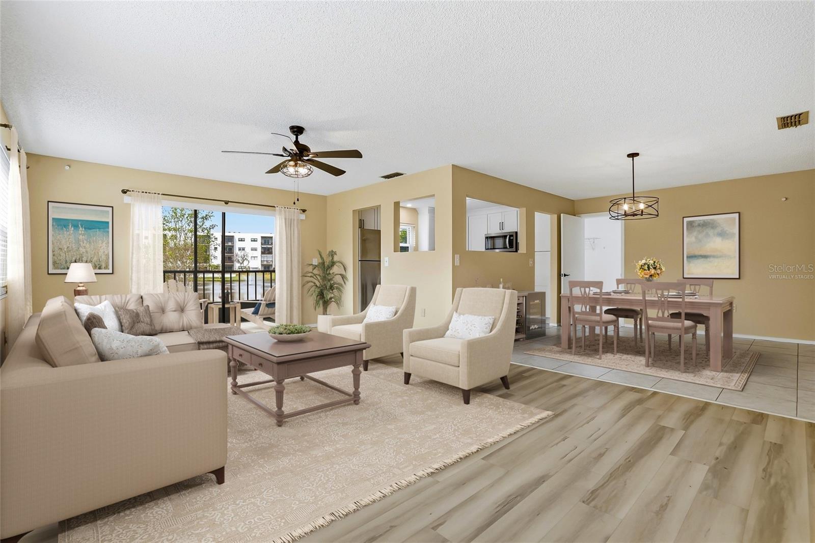 Virtually Staged. Great room with flexible furniture space and a calming water-view backdrop.