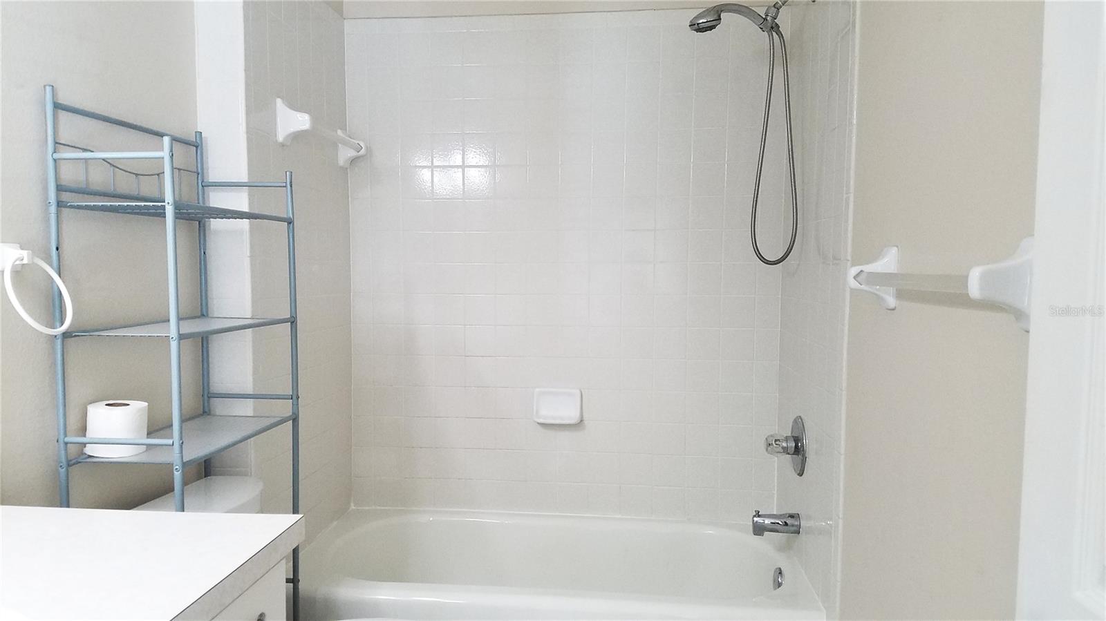 Main bathroom with tub and showerl