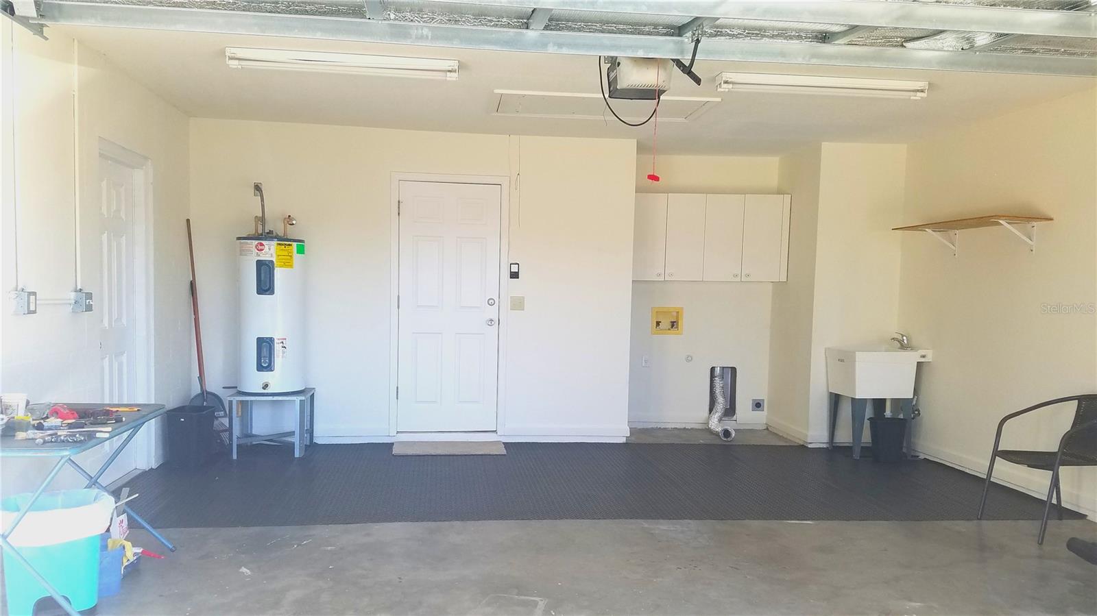 Garage with utility sink, washer-dryer hookups, hot water heater, Electric Box