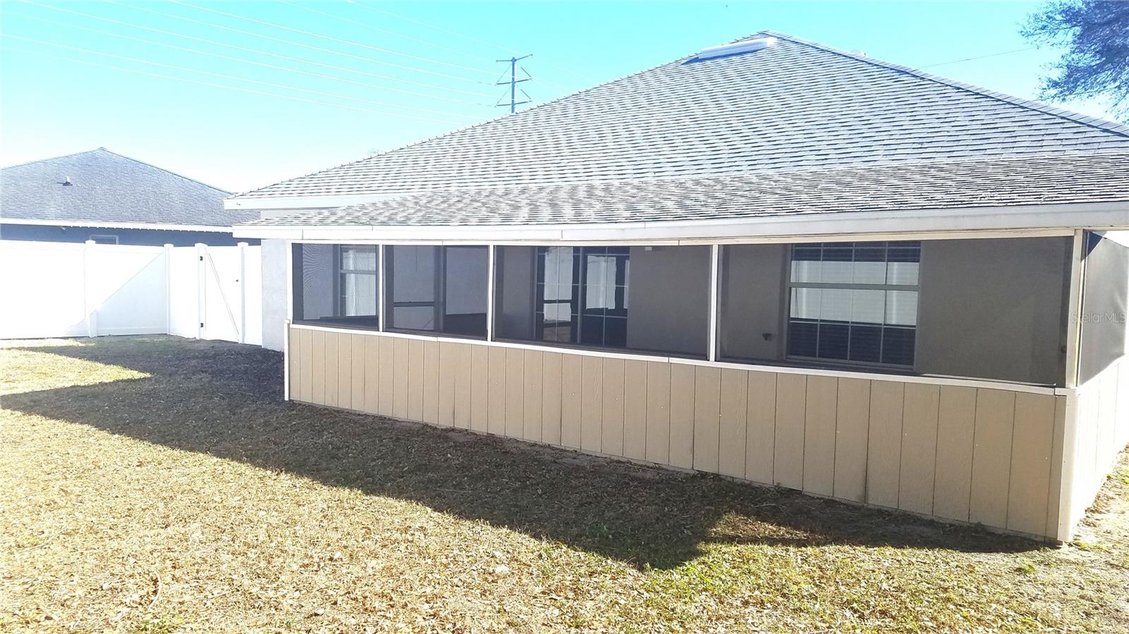 BACK SCREENED PORCH, NEW ROOF, PORCH WALLS REDONE, NEW WHITE FENCINGL