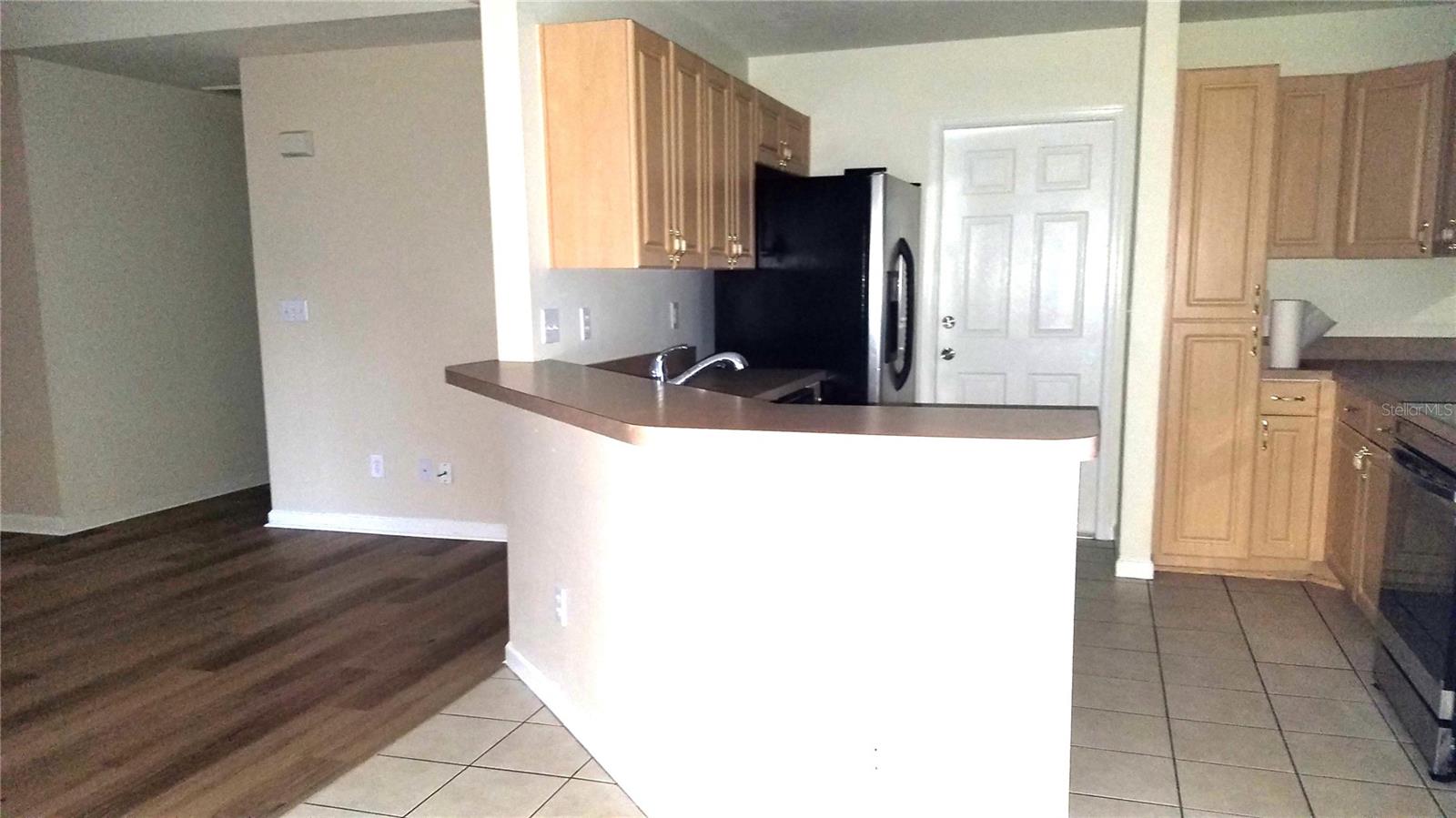 KITCHEN BAR, BACK DOOR TO GARAGE, PANTRY
