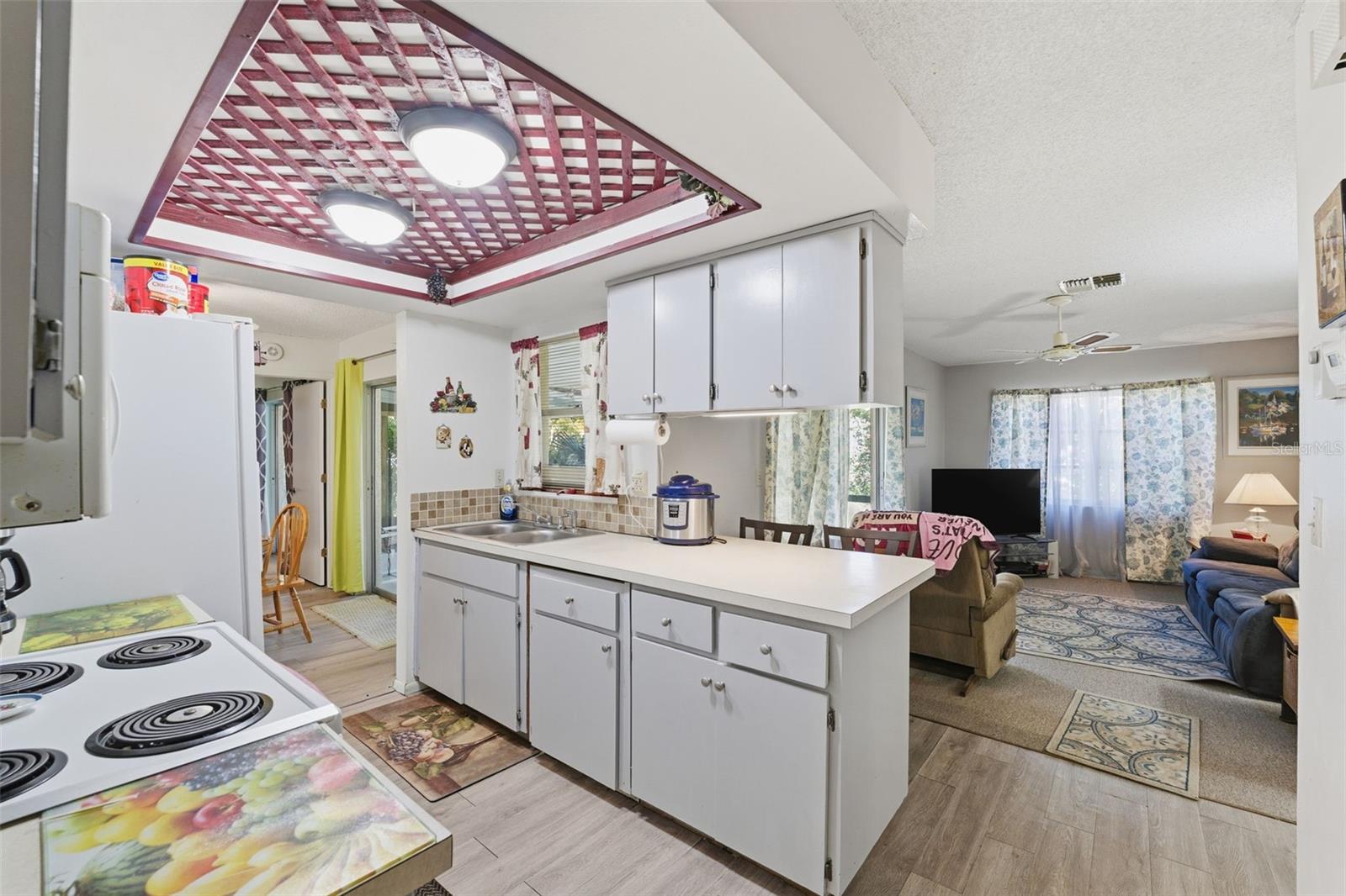 Kitchen overlooks backyard and Family room