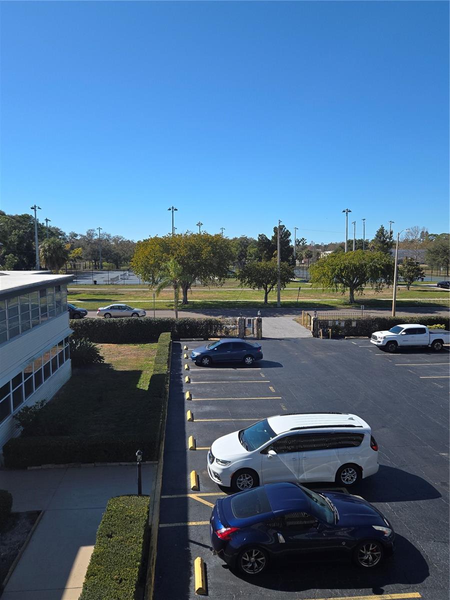 Assigned parking space located inside gated community where the white truck is parked in picture
