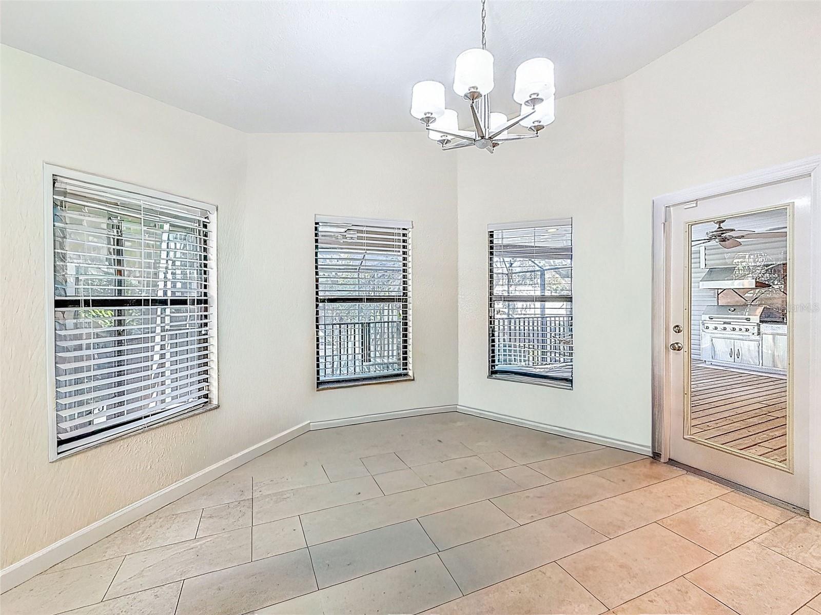 Dining Area in kitchen. Over looks pool & ourdoor kitchen balcony