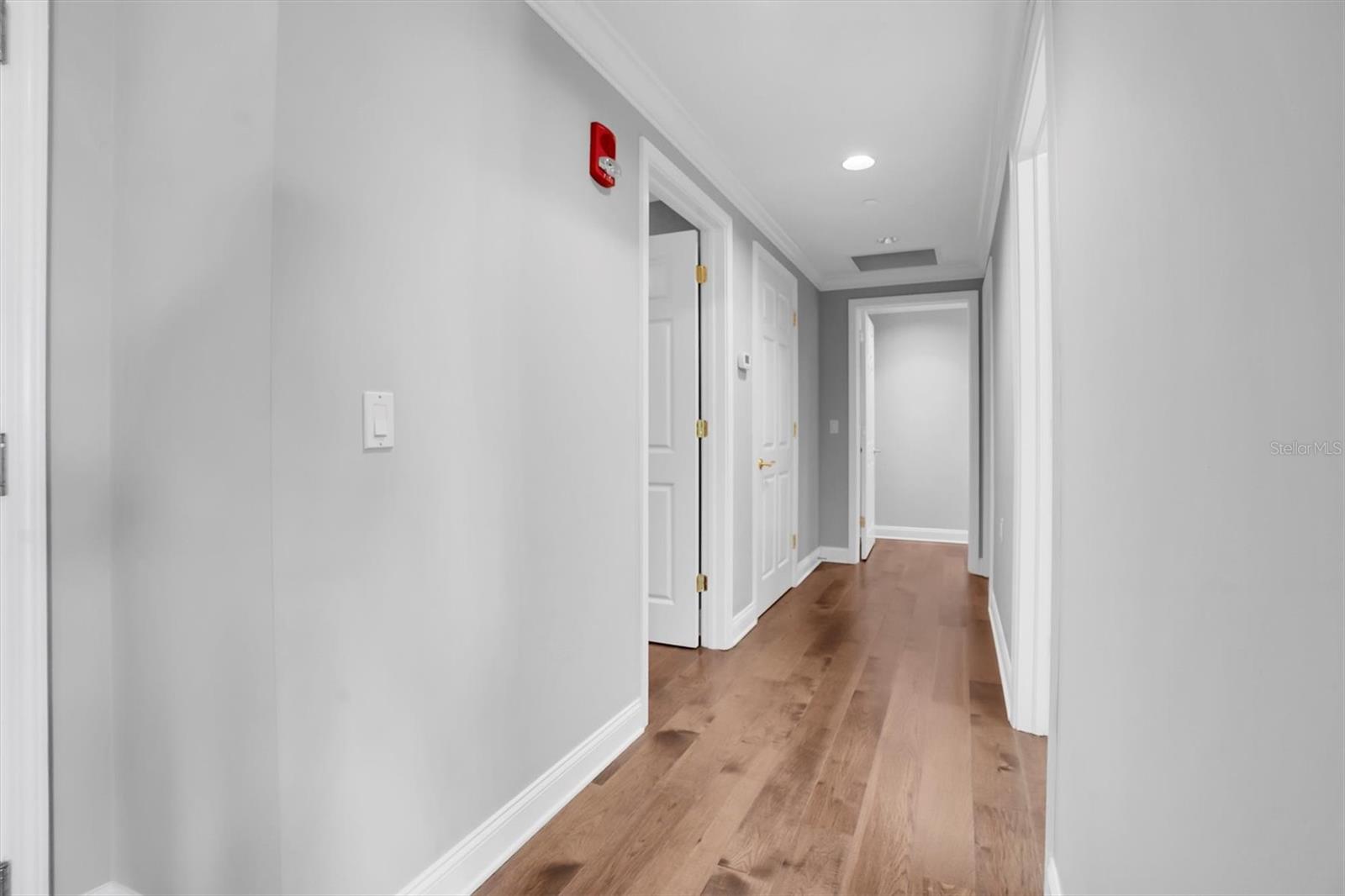 Hallway to second bedroom & laundry