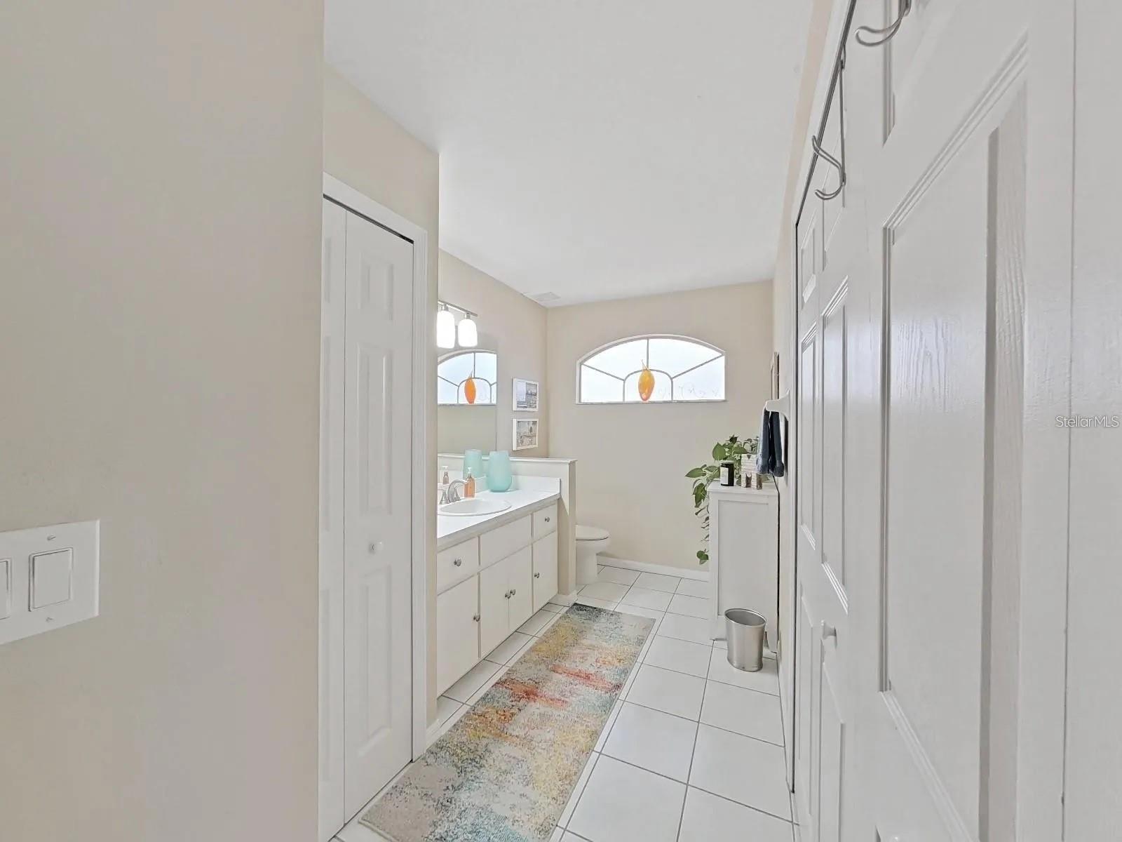 LARGE GUEST BATHROOM WITH LAUNDRY CLOSET