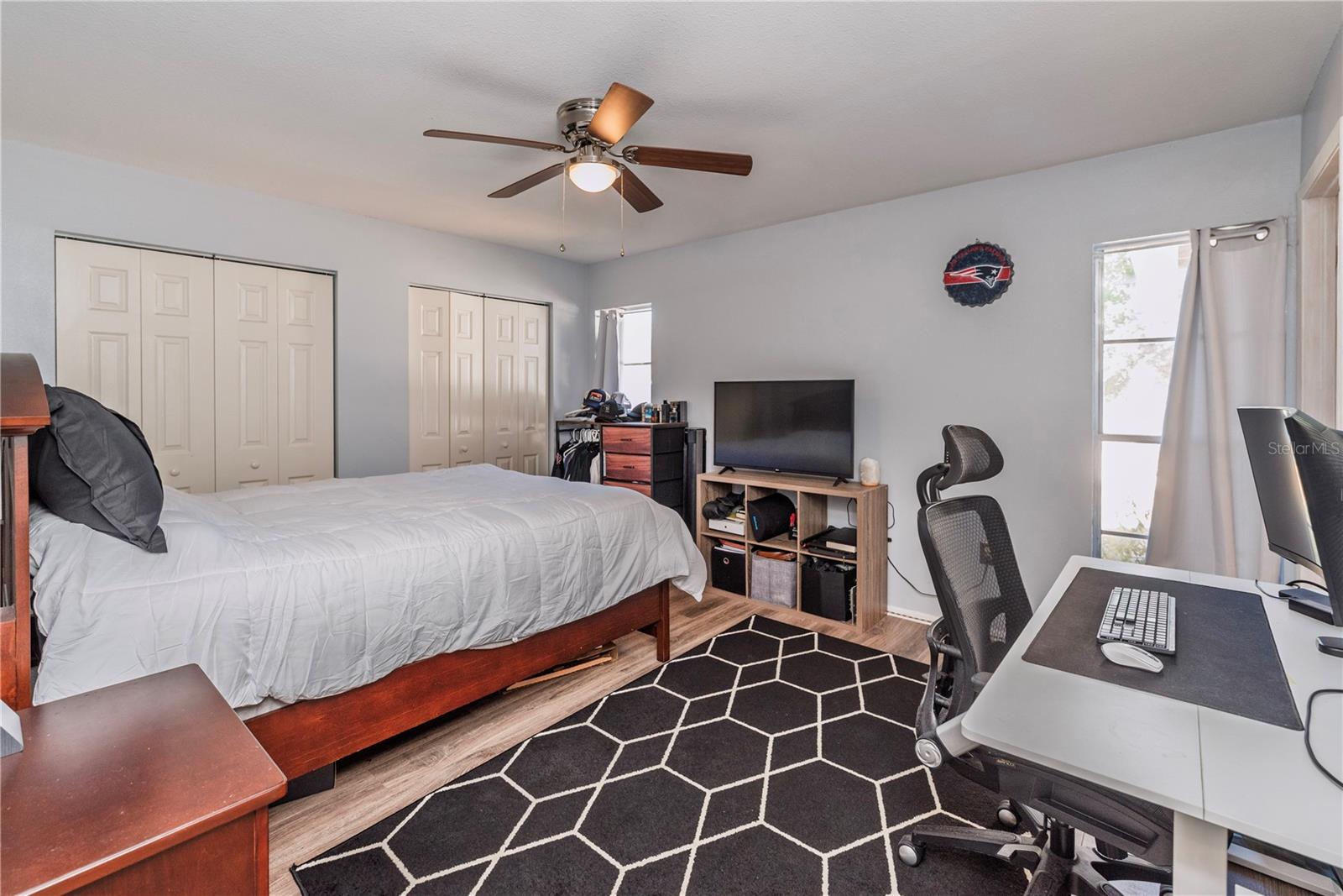 Second primary bedroom with dual closets and ensuite bath.
