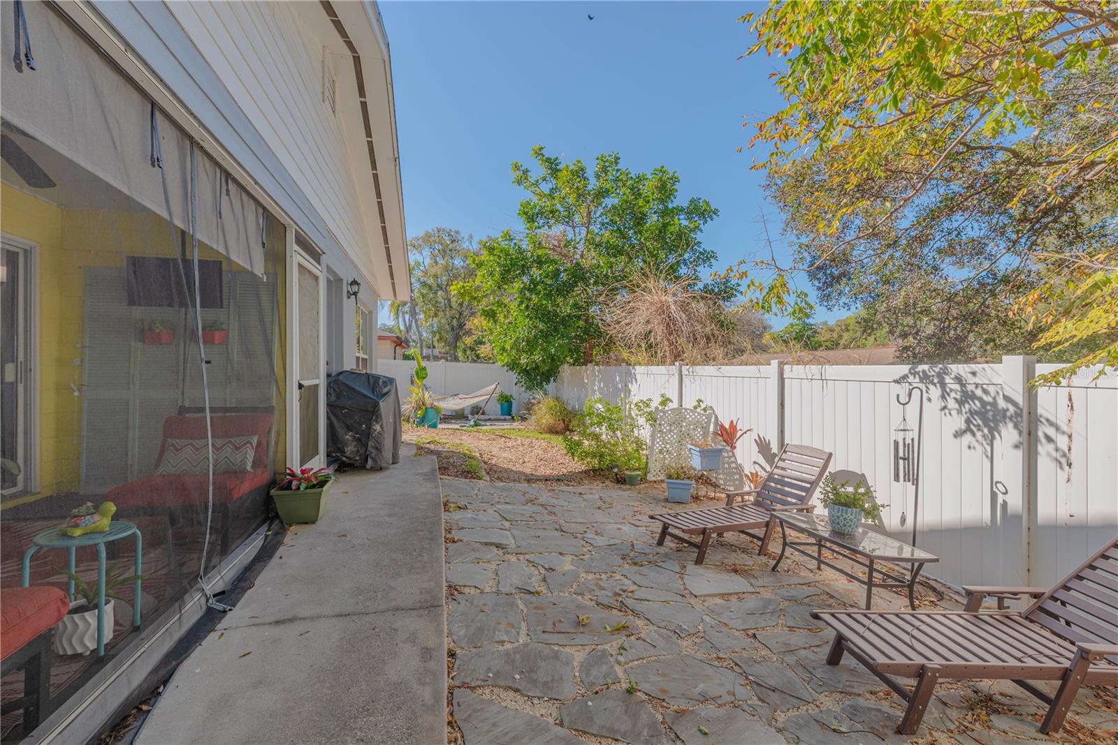 Paver patio at the right rear of the home.
