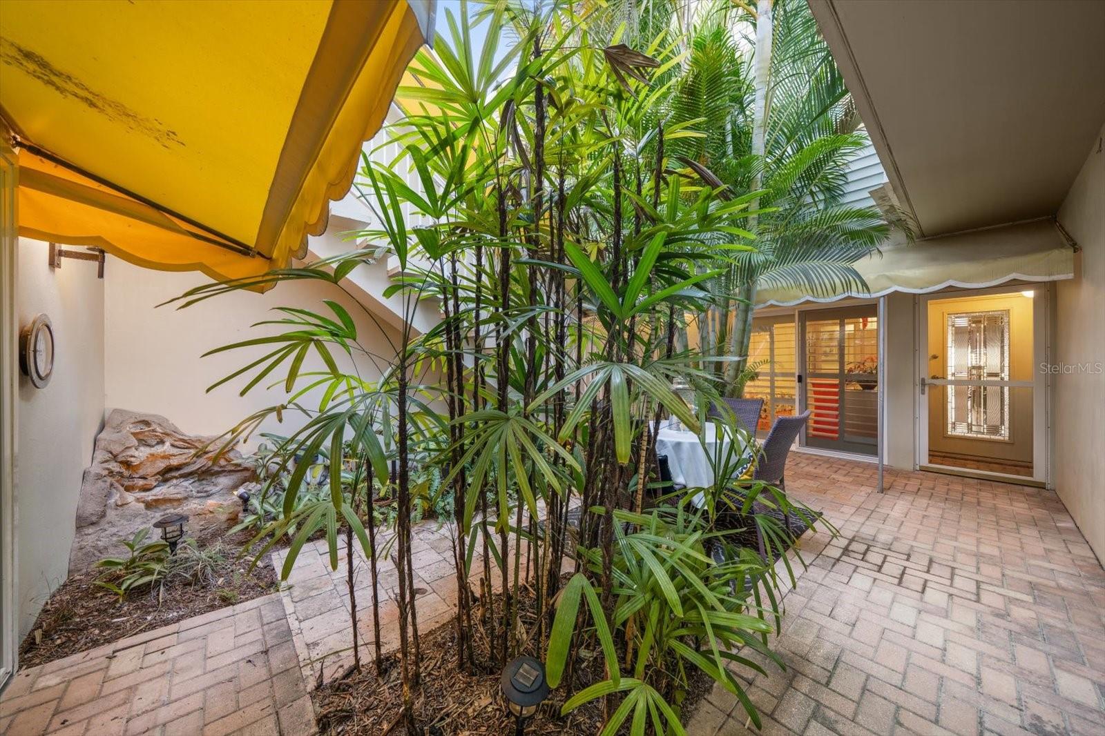 Entry to this lovely property that lives more as a single family home than a condo!