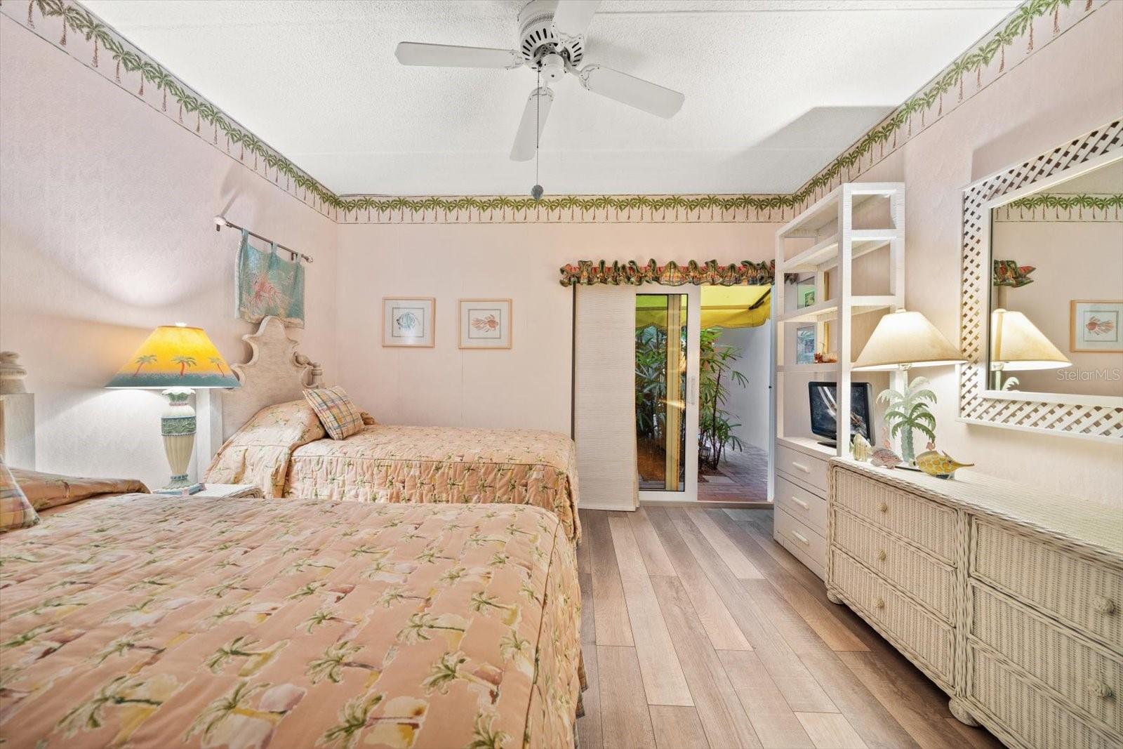 Fully furnished second bedroom suite off of private courtyard.