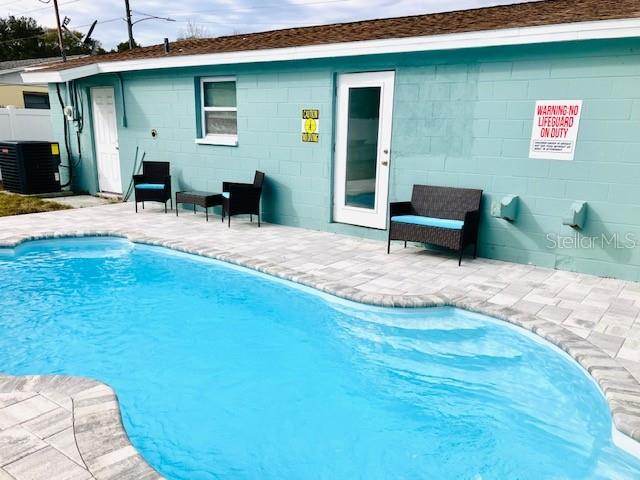 Sparkling private pool with spacious paver deck offering a true resort style feel.