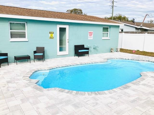 Recently installed pool and paver patio create a stunning outdoor retreat perfect for entertaining or enjoying Florida sunshine.